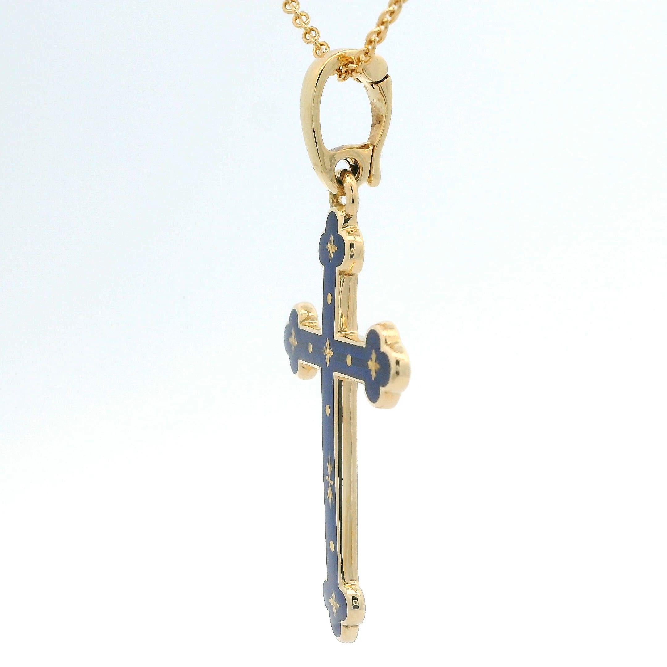 Exquisite Fabergé 18-Carat Yellow Gold Cross Pendant With Deep Blue Translucent Enamel, Paillons and Diamond Accents. 

Elevate your style with this beautifully crafted Fabergé pendant—a distinguished addition for collectors on 1stdibs who
