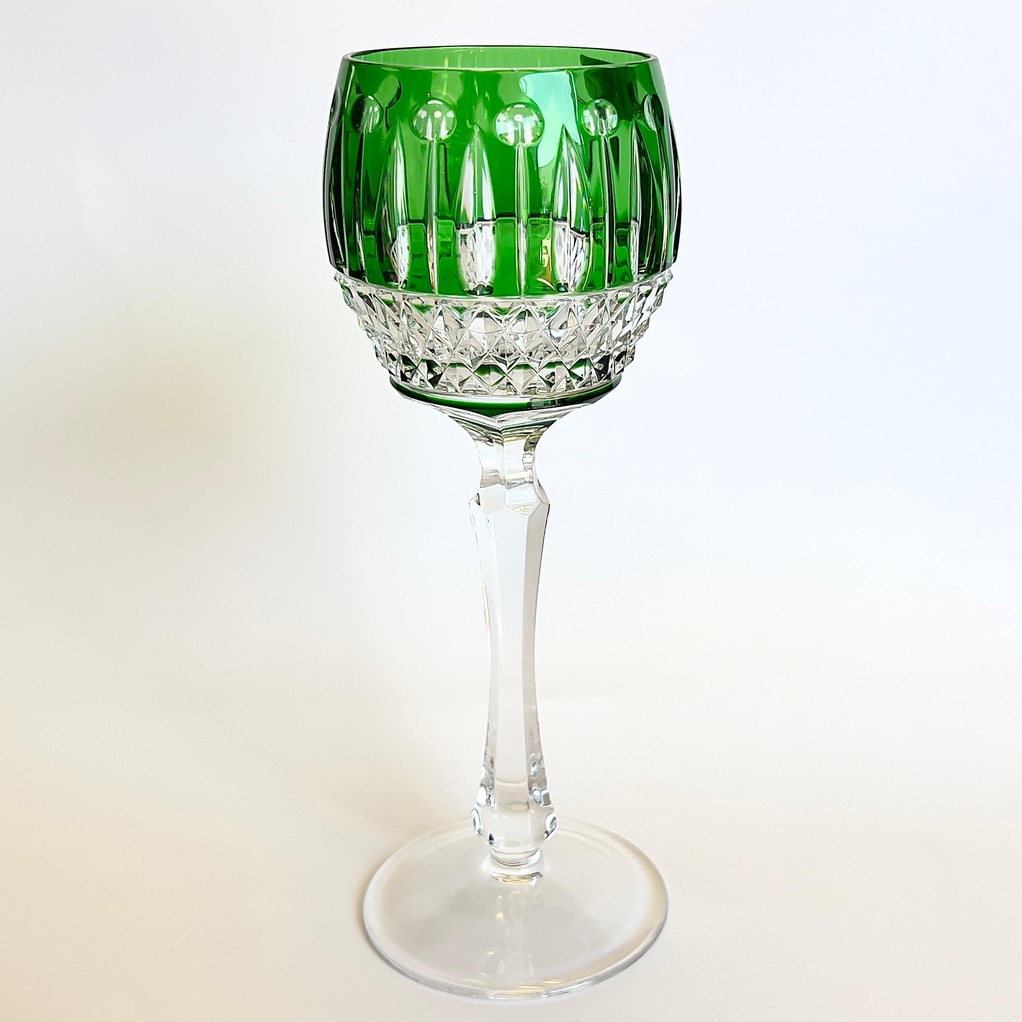Set of 4 multicolor cut-to-clear crystal Fabergé Xenia hock wine glasses with faceted cuts throughout and acid etched brand stamps at underside. 
Faberge crystal wine glasses comes in beautiful deep rich colors.
Each stem is sign/etched FABERGE and