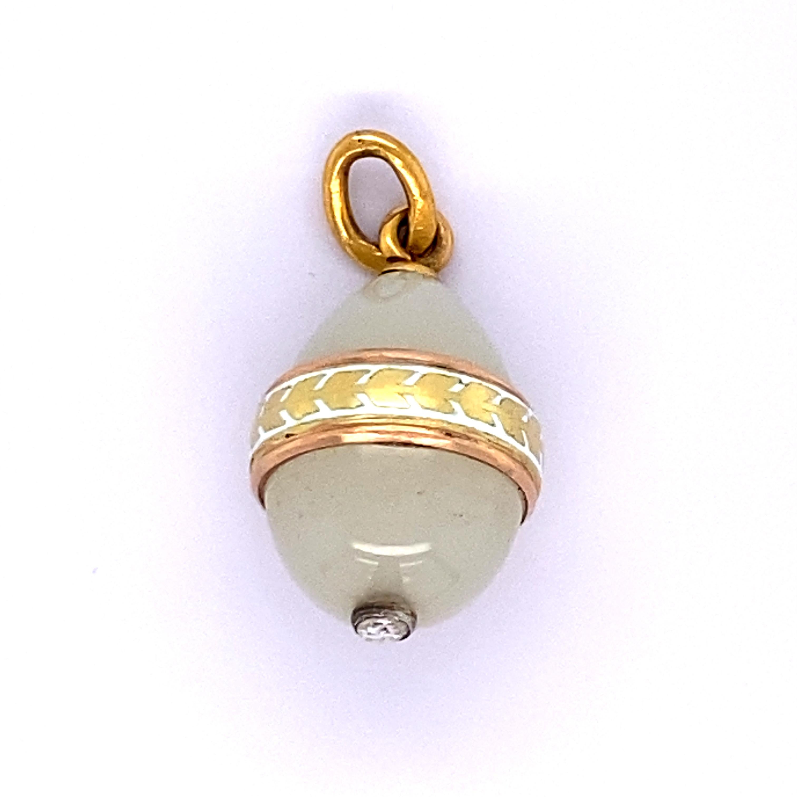 Faberge egg pendant , off- white agate stone set with rose cut diamond and enamel work.  weighing 4.2 g / 2.70 dwt