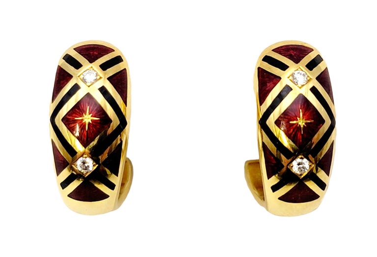 Absolutely stunning earrings designed by Faberge. These exquisite half hoop huggie earrings are made of luxurious 18 karat yellow gold. The front is adorned with a polished red and black enamel with a guilloche motif, accented by sparkling diamonds.