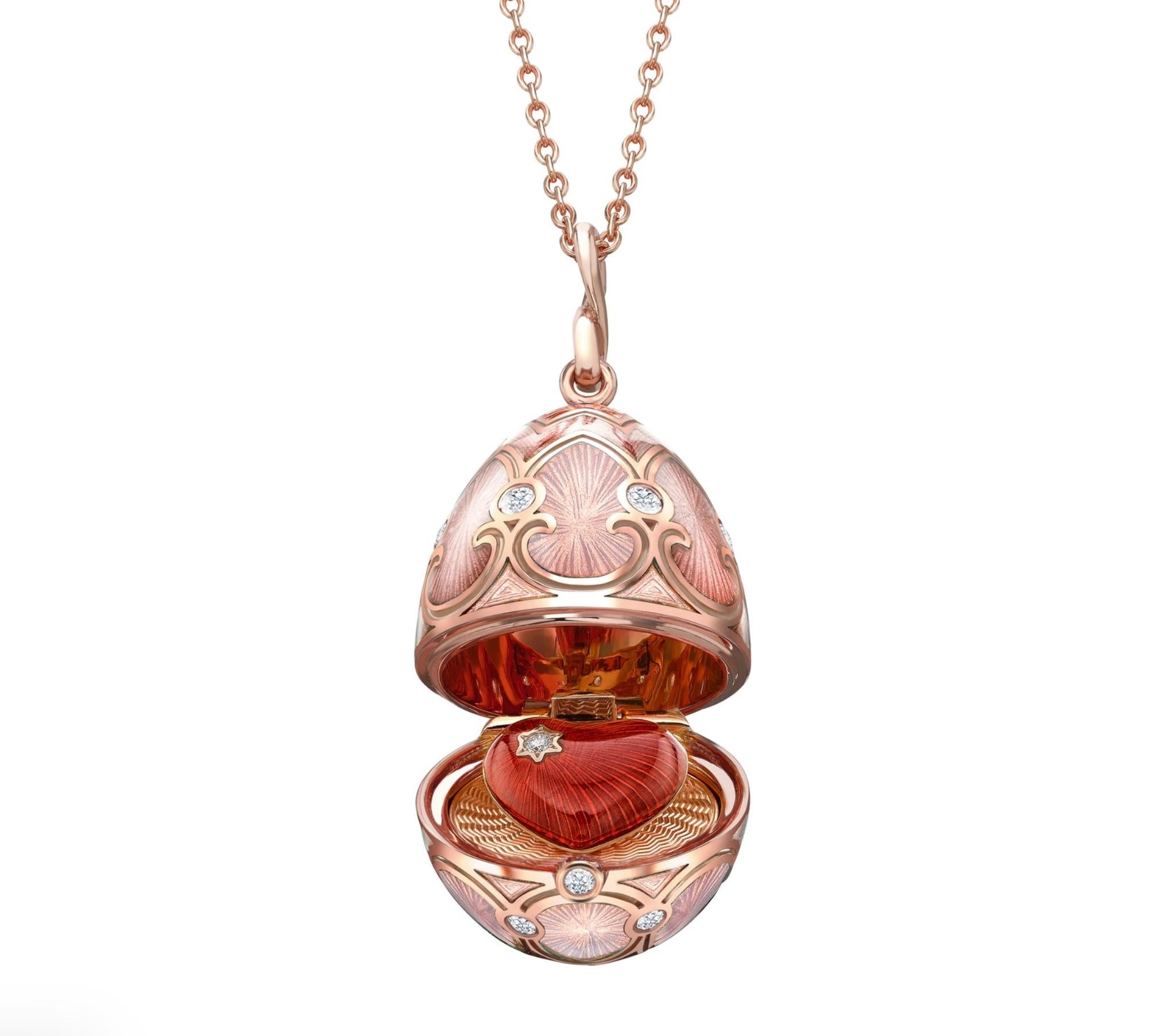 The heritage rose gold diamond and pink guilloche enamel heart surprise locket features pink guilloche enamel and round white diamonds, set in 18 karat rose gold.  In keeping with its fondness for delight, surprise and discovery, Faberge has