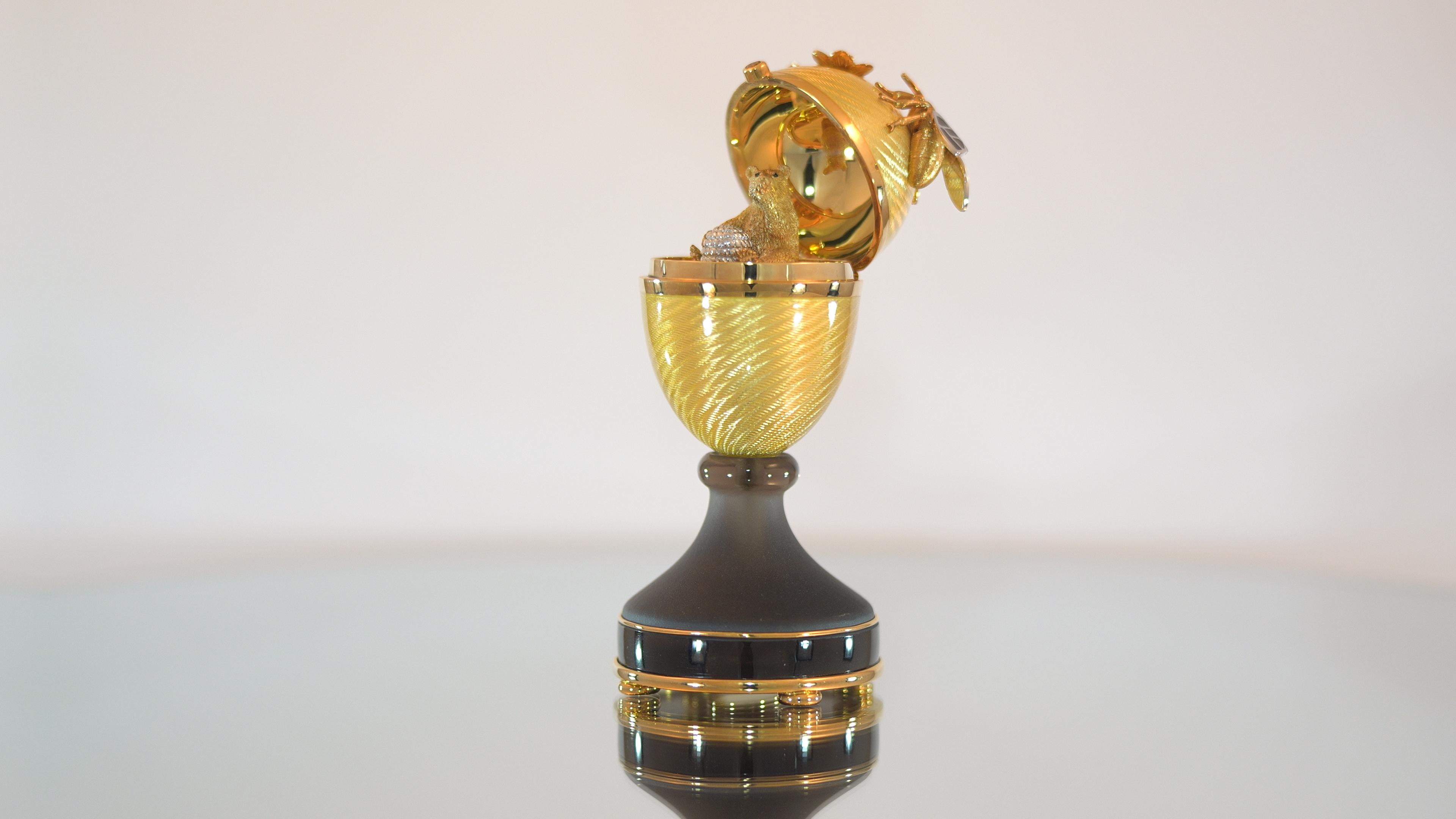 Fabergé Honey Bear Egg, 18k Yellow Gold, Clear Flux Enamel, Smoky Quartz, Citrines, Diamonds

The Honey Bear Egg, created in 2002, is one of the most playful designs of the modern Fabergé collection. On the exterior, a bee pauses delicately before