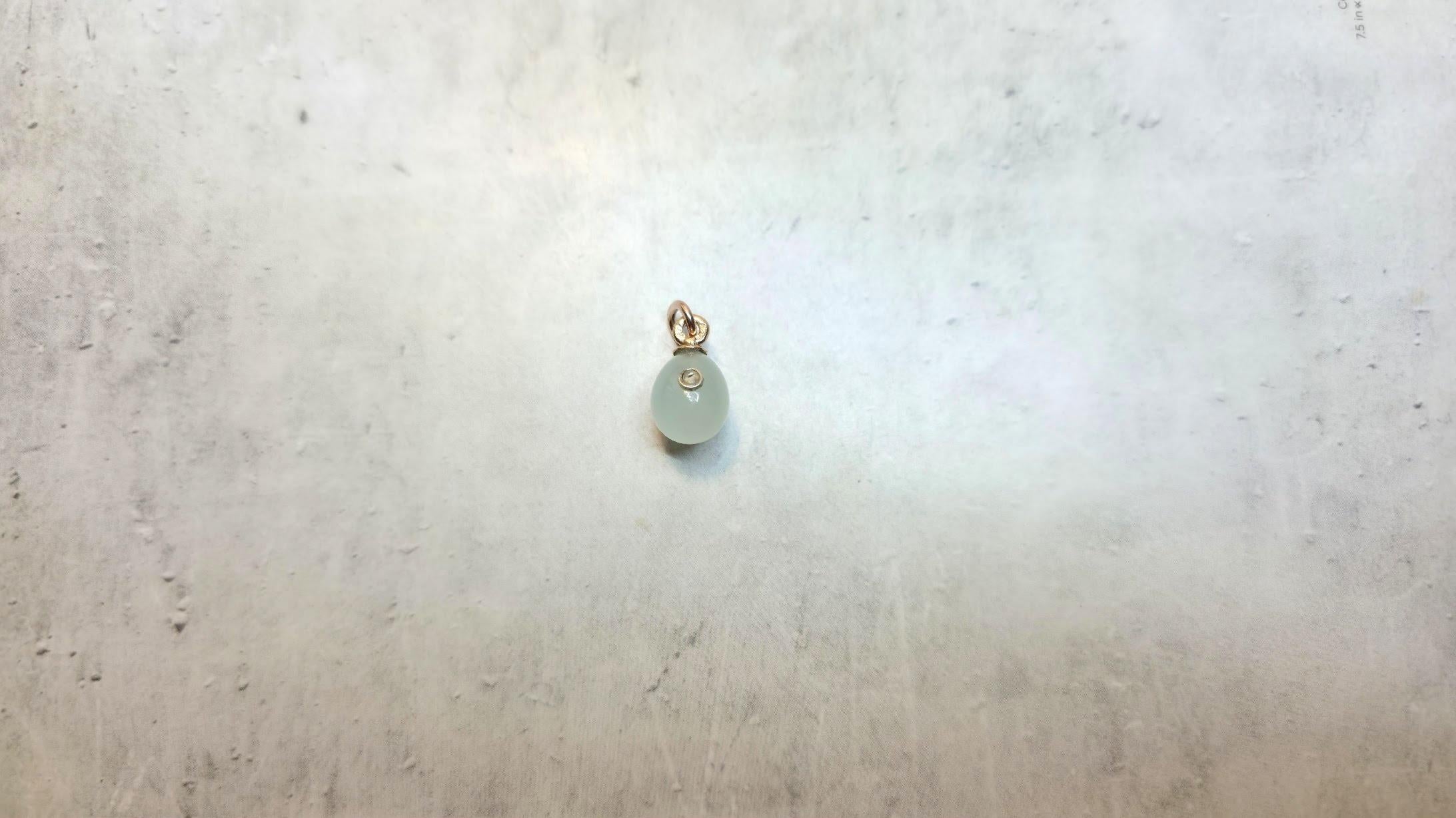 We are pleased to present another exceptional item from our collection—a beautiful and highly unusual miniature rose gold egg pendant crafted from natural chrysoprase and adorned with a faceted diamond element.. This exquisite piece is attributed to