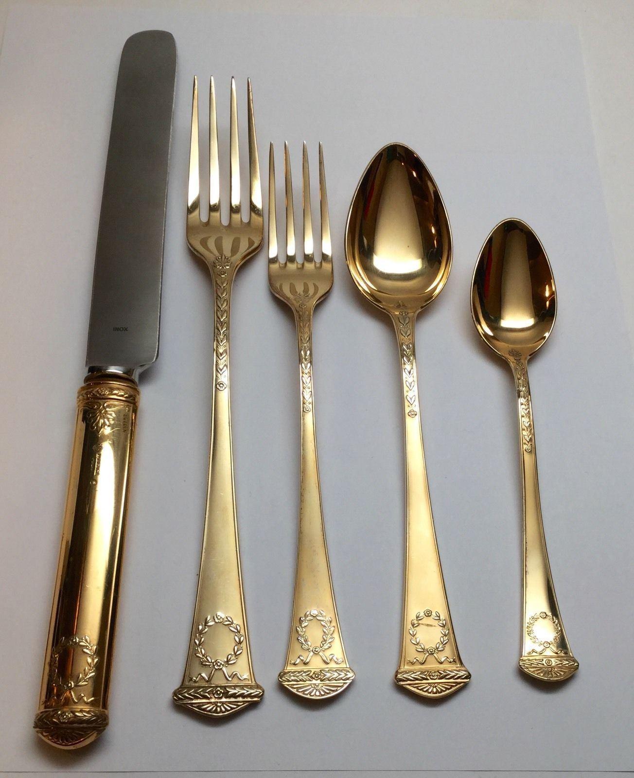 Faberge sterling silver vermeil 5-piece place setting in the imperial court pattern. 
Marked: Faberge hallmarks, FABERGE STERLING. 
No monogram. 
Measures: Dinner knife 10 1/4