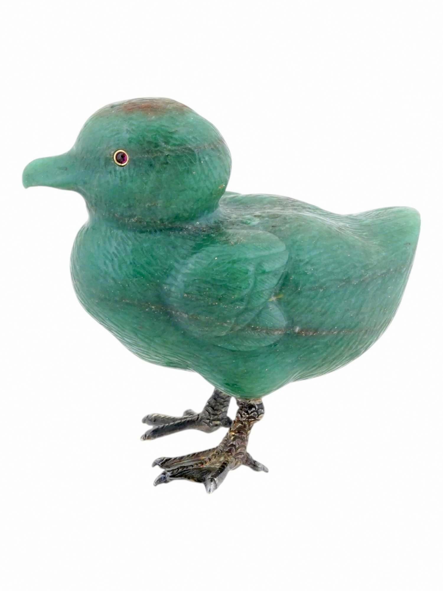Let us introduce another exquisite piece from our beloved collection — a stone figurine by the renowned Carl Fabergé firm. This delightful duckling is carved from genuine Russian nephrite, featuring garnet eyes framed in gold. The duckling’s feet