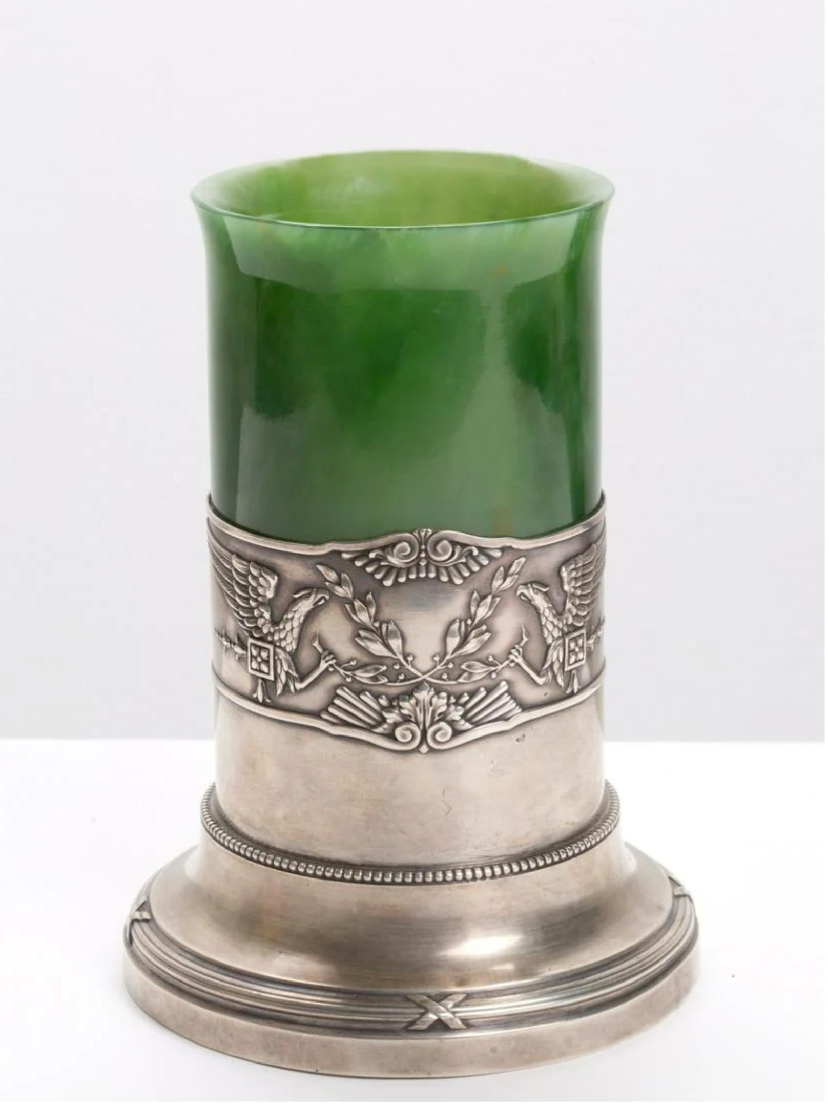 A rare and magnificent piece by Fabergè, Moscow in the early 1900s. Excavated green jade vase, inserted in a finely embossed silver base. Under the vase we can see his Punch FABERGE', Russia on the bottom. 
Early 20th century. 
A unique piece or