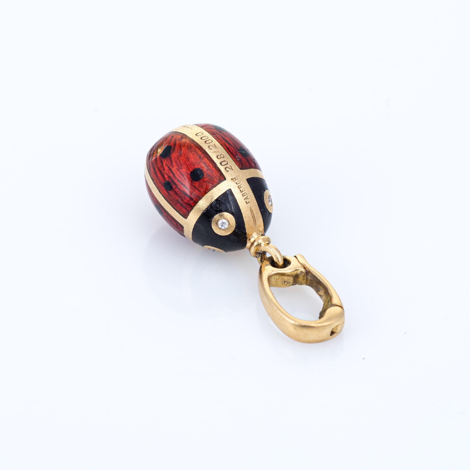 Sweet Faberge ladybug charm crafted in 18 karat yellow gold.  

Diamonds total an estimated 0.02 carats (estimated at G-H color and VS2 clarity). 

The ladybug is beautifully enameled in red and black, with diamond set eyes (both sides). Also
