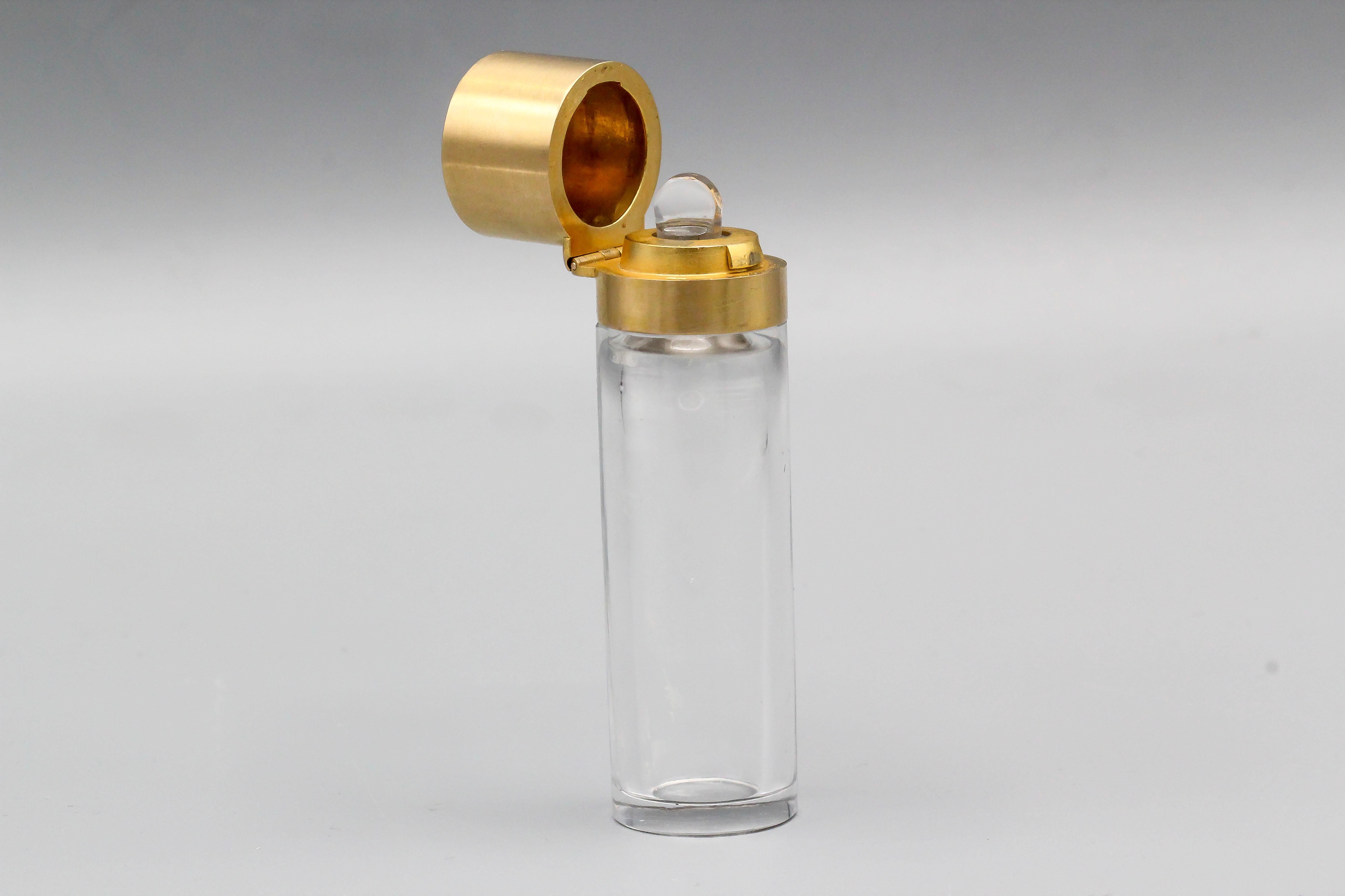 Very rare and unusual diamond, moonstone and 14K yellow gold perfume bottle/flask made by Faberge, circa late 19th century. It features high grade diamonds along with a cabochon moonstone in the middle. Container is made of clear glass. Made by E.