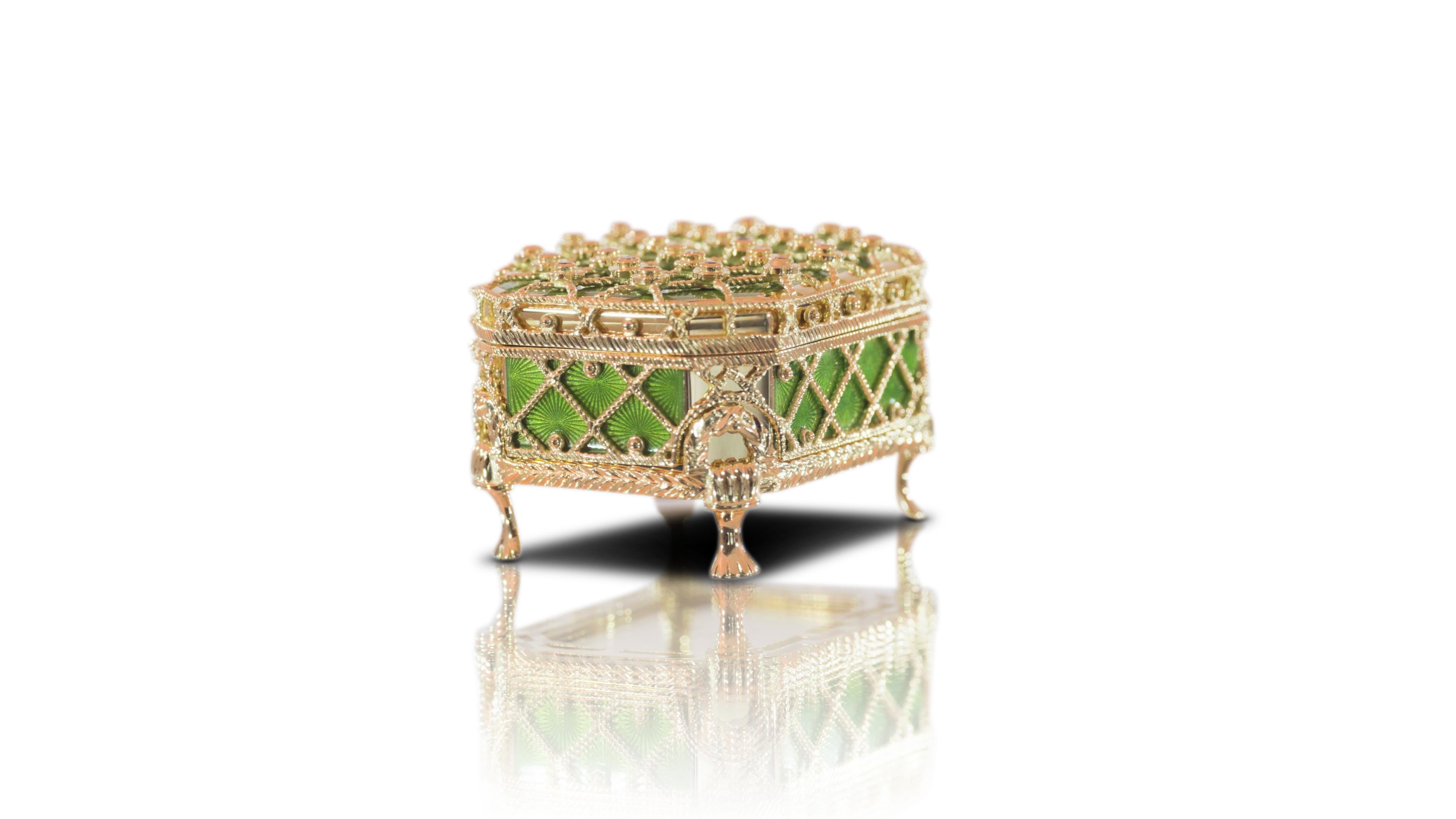 Fabergé Limited Edition Pill Box 18K Yellow Gold, Vitreous Green Enamel, Diamonds 0.30 ct G VS, Rubies 0.48ct 

This piece is an original modern Fabergé creation, crafted in 18k gold by the master artisans of Victor Mayer in Pforzheim, Germany.