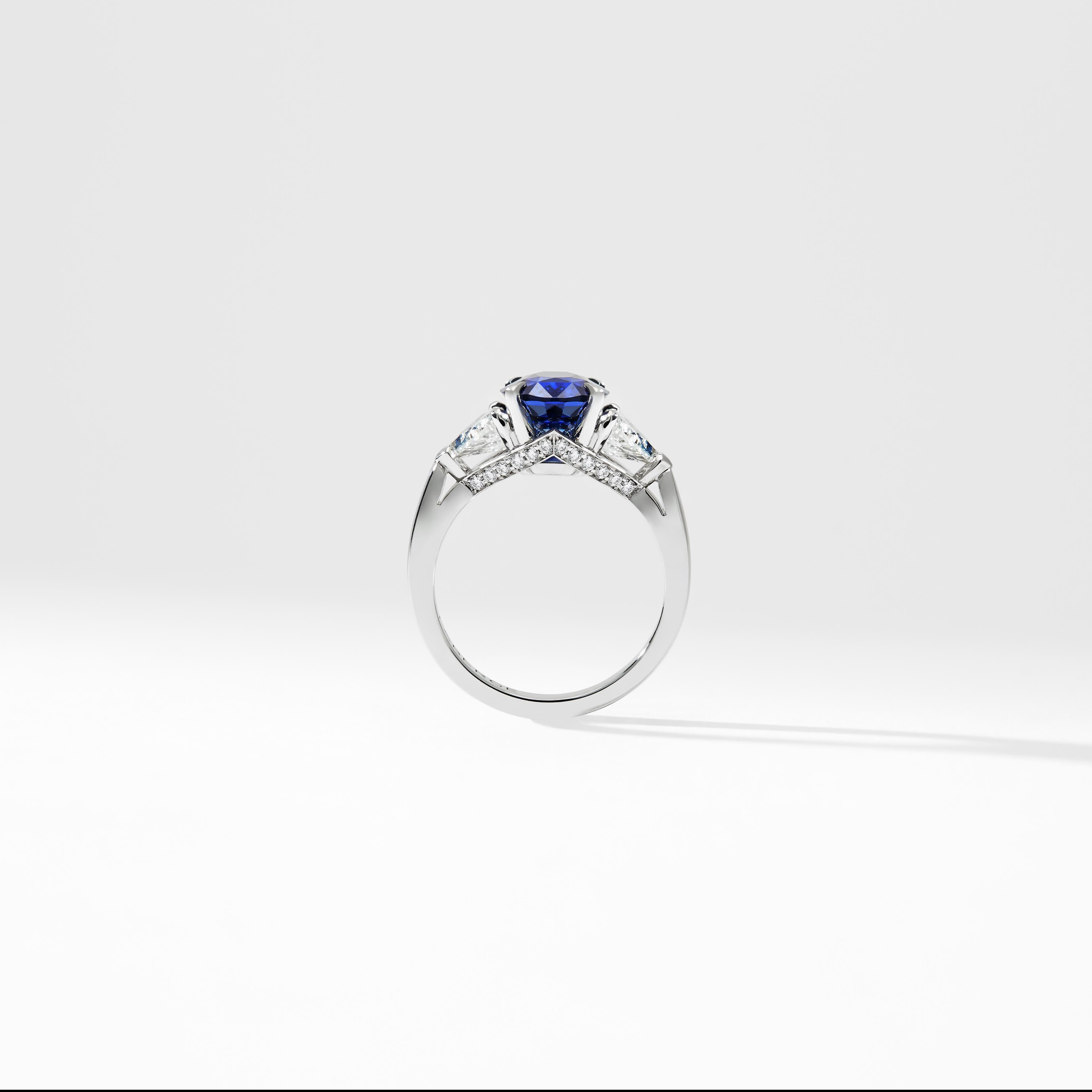 Round Cut Fabergé Platinum Oval Blue Sapphire Ring With Pear Shaped & Round White Diamonds For Sale