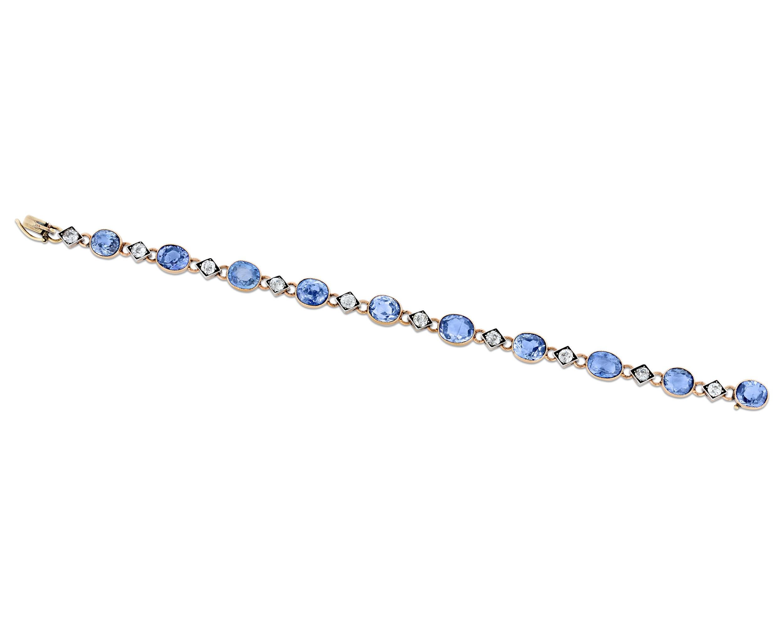 Epitomizing the decadence of Imperial Russia at its peak, this spectacular antique sapphire and diamond bracelet hails from the famed House of Fabergé. With 10 untreated oval cut blue sapphires weighing an astonishing 18 carats, the bracelet exudes