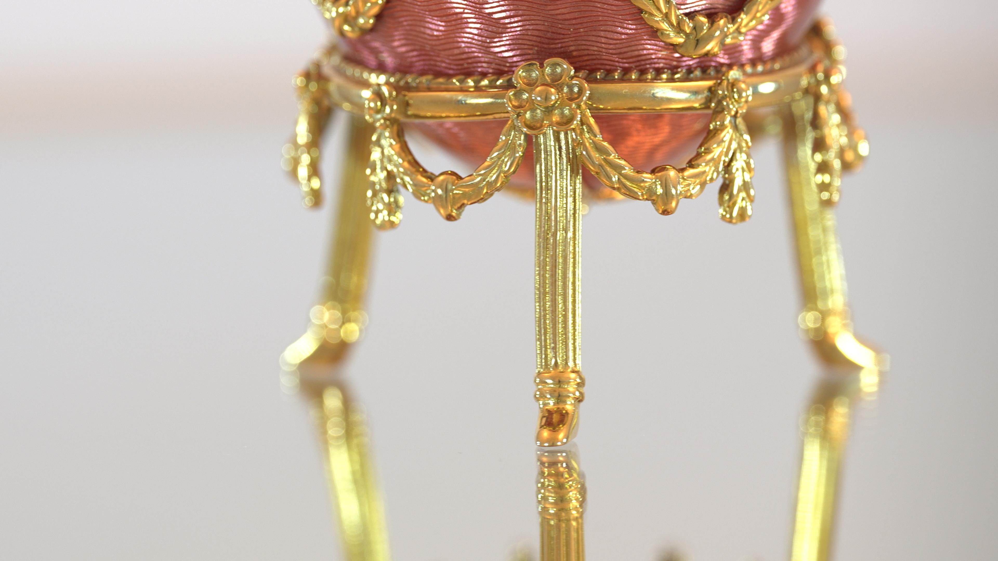 Fabergé Serpent-Egg Object, 18k Yellow Gold, Translucent Pink Guilloché Vitreous Enamel, Diamonds 0.36 ct, Emeralds

This Fabergé egg, created in 1991, is a tribute to Fabergé’s historic designs featuring serpents, such as his celebrated cigarette