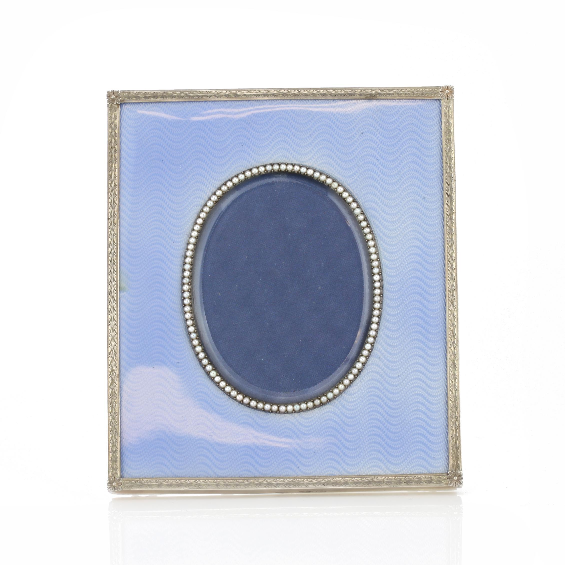 Faberge silver and guilloché enamel frame, St. Petersburg circa 1900 by famous head workmaster Mikhail Perkhin. Stamp 88 for Russian silver, Faberge in Cyrillic. 

Dimensions - 
Size: 10 x 8.5 cm.