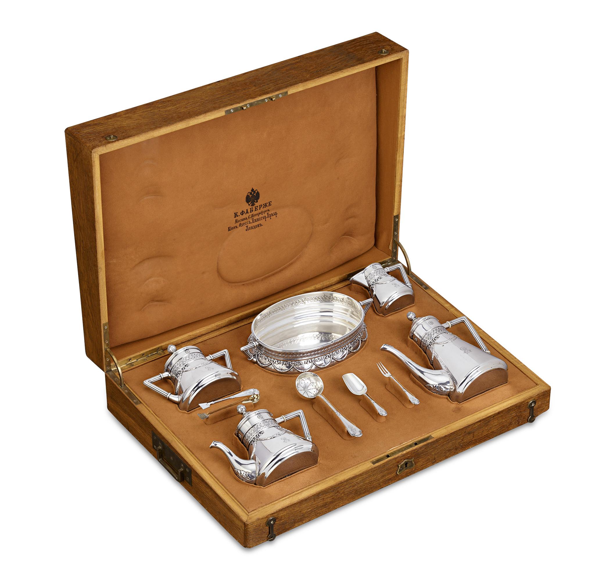 This exceptional nine-piece tea, coffee, and dessert service from the world-renowned House of Fabergé is exquisitely detailed. The rare set hails from the high period of Fabergé silver craftsmanship and is a lasting testament to the unparalleled