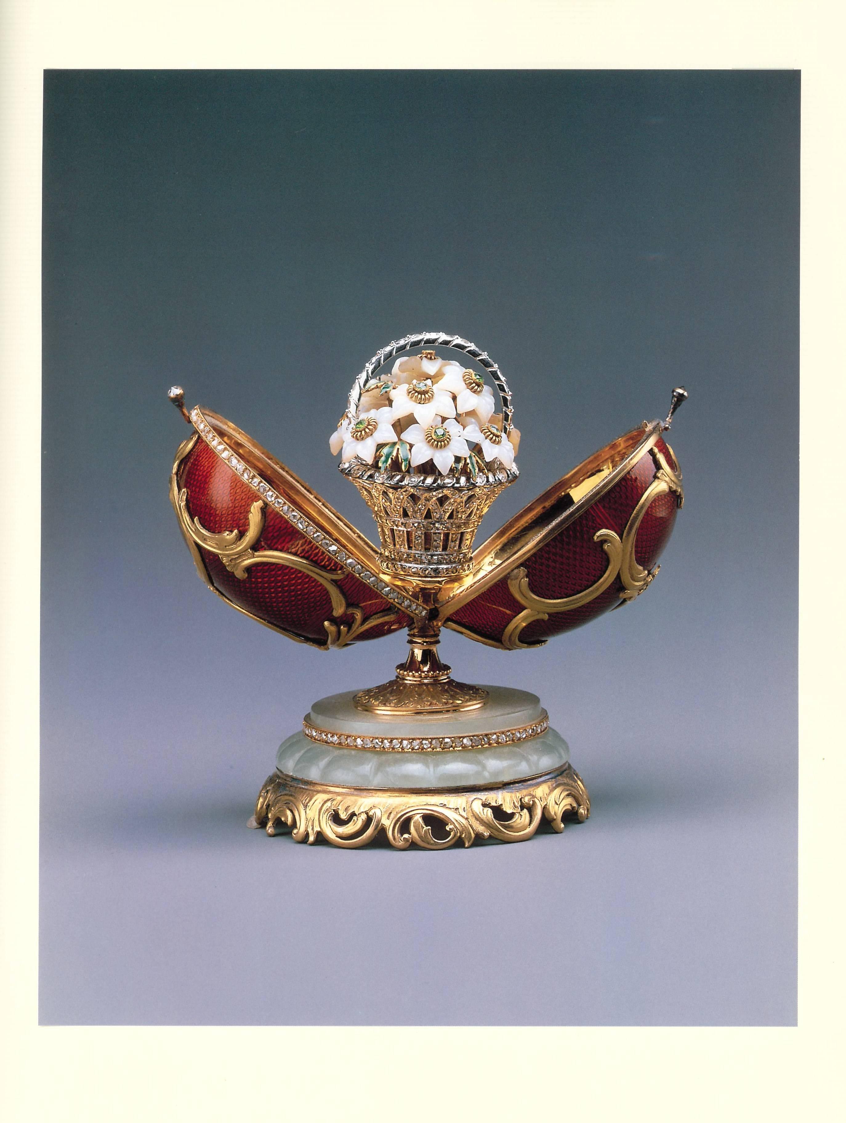Hardcover with pink silk padded boards and silver decoration and lettering, this beautiful book is lavishly illustrated with colour photographs of all things Faberge in the Forbes Collection. Which included at one point the largest collection of