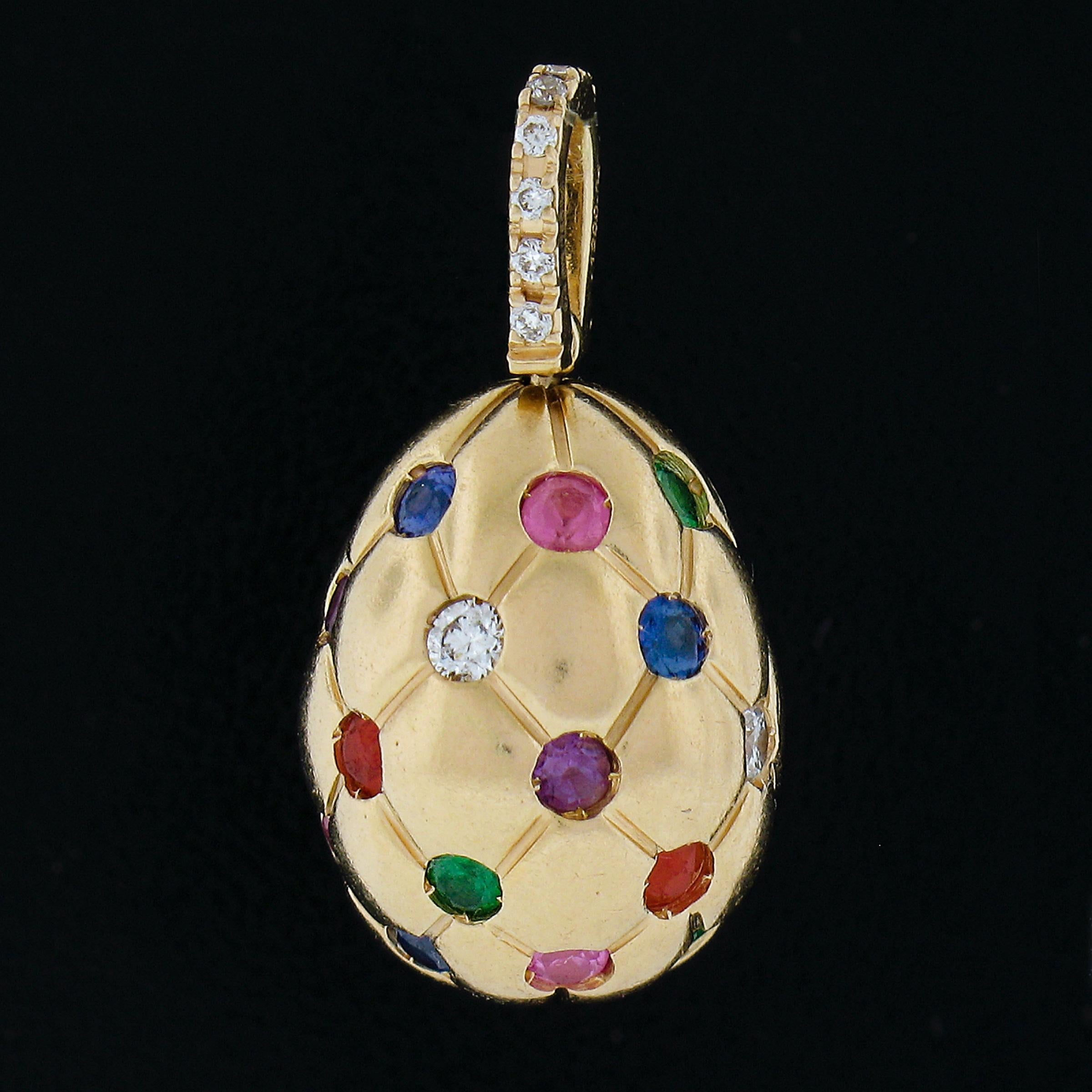 Here we have an adorable egg charm by Faberge features 18k brushed rose gold and encrusted with multi colored gemstones and diamonds pave set in a quilting pattern throughout. Signed properly and remains in excellent overall physical condition. An