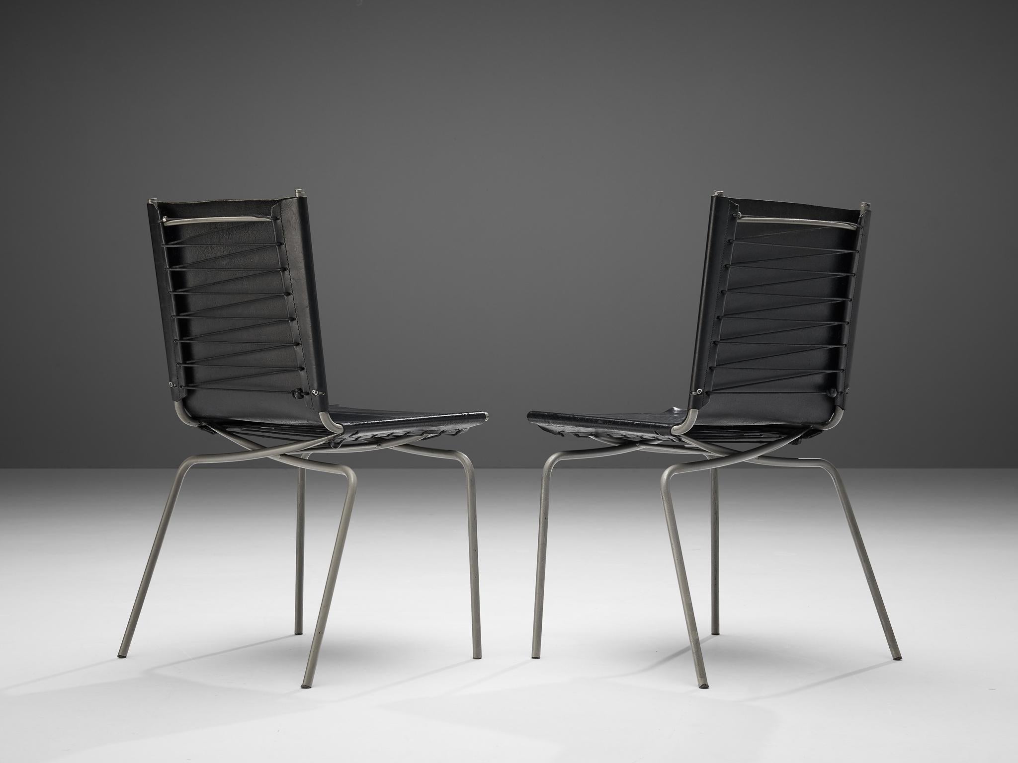 Fabiaan Van Severen, dining chairs, patinated black leather, tubular steel, lace, Belgium, 1997.

Distinct pair of dining chairs by Belgium designer Fabiaan Van Severen. Created in 1997, this design features a patinated leather seat and backrest