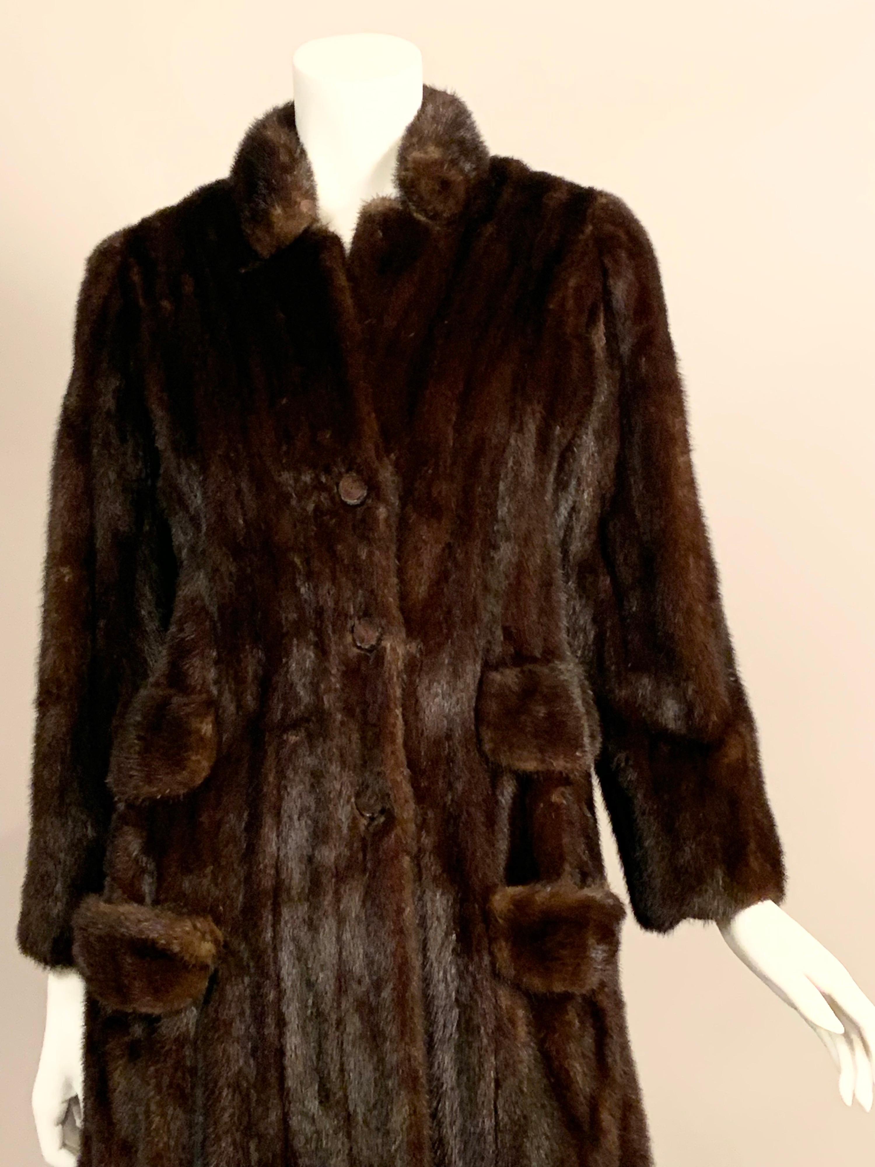 Fabiani was a designer of Haute Couture in Rome and this dark brown mink coat is a stunning example of his timeless and classic style.  He was known for clean lines and quality tailoring.  This coat has a face framing stand up collar, three button