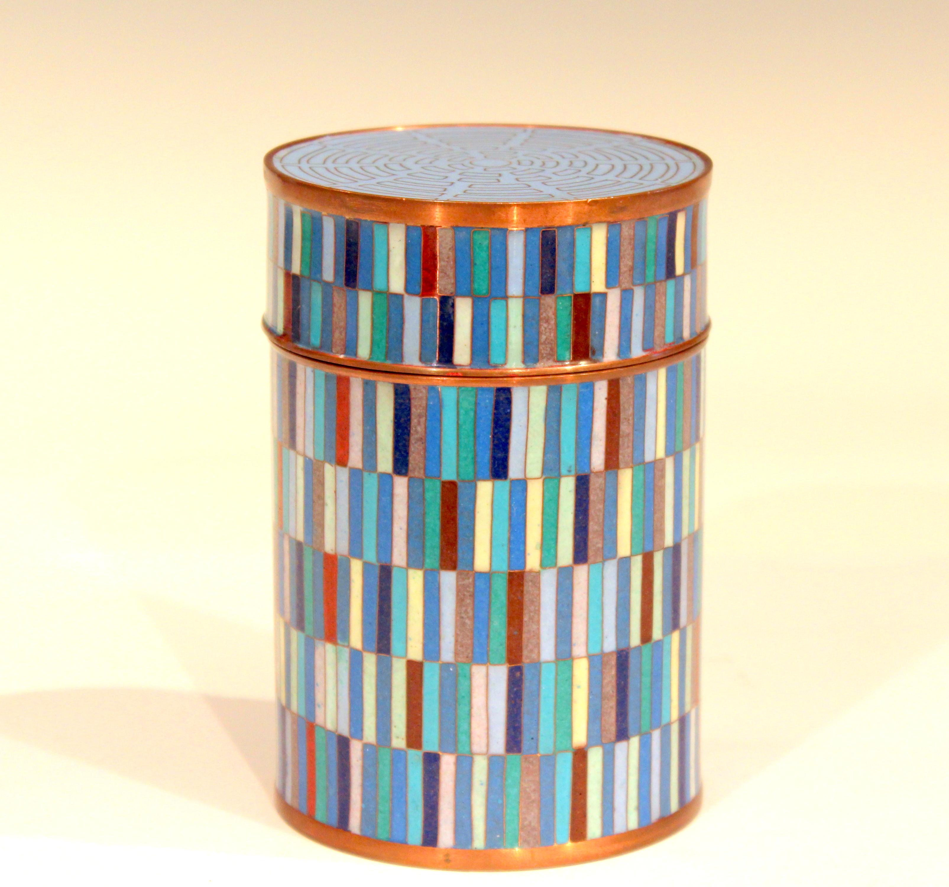 Vintage Fabienne Jouvin Cloisonné jar and cover with intricate design of multi colored bars. Great design, beautifully executed. This Parisian artist is still working. These were made in the 1990s. Measures: 5 1/4
