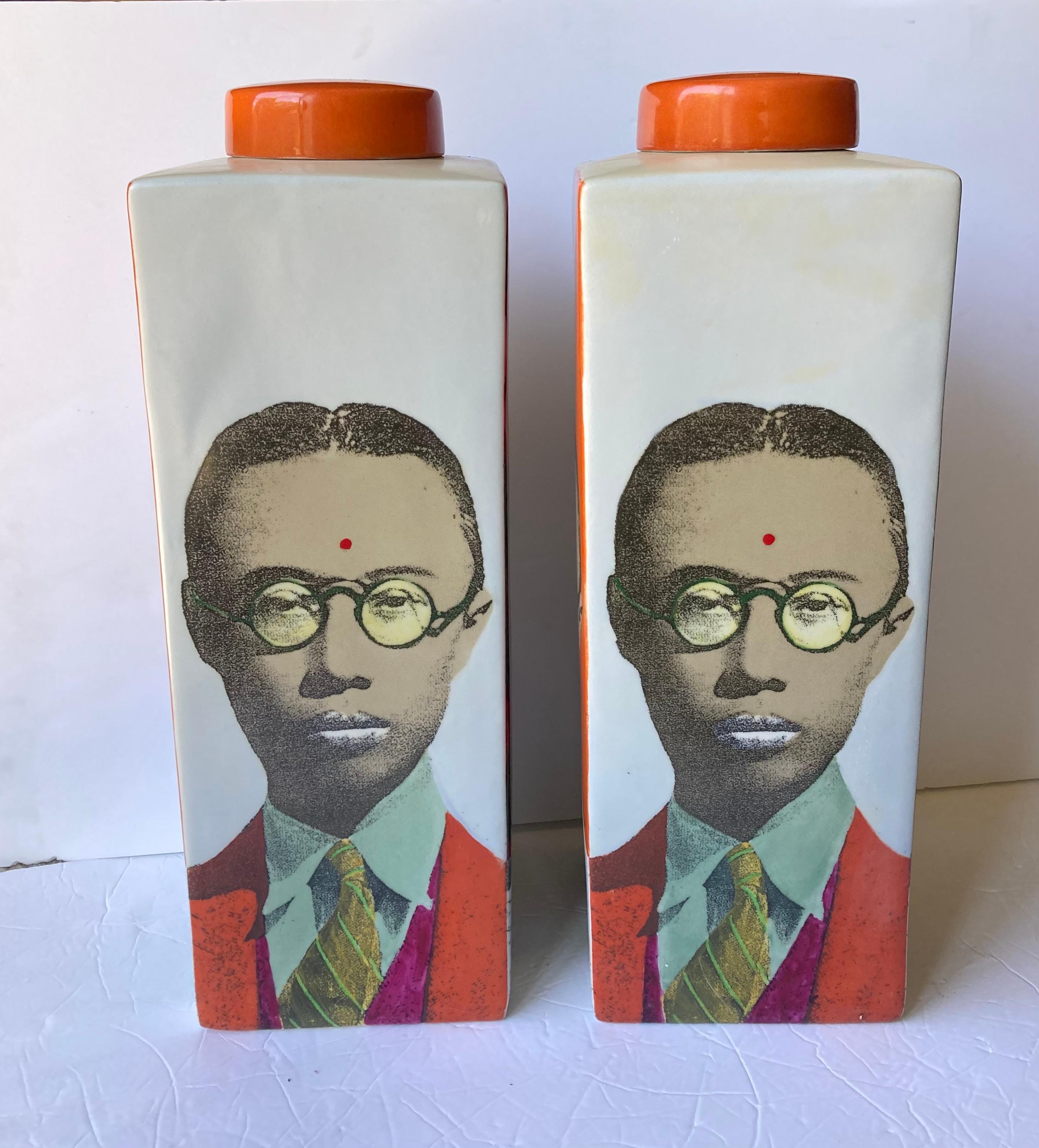 Two lidded ceramic jars by the well known artist/designer Fabienne Jouvin . They picture the image of the last China emperor Pu Yi in a post modern pop art style . Price is for each piece. 