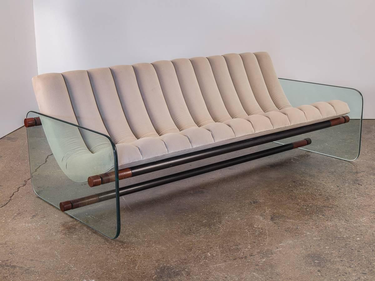 Italian Space Age Sofa attributed to Fabio Lenci. A stunning and sexy, impressive sofa. This sofa has been fully restored. The channeled cushions are newly stuffed and upholstered in a plush Romo velvet. The curving, low-slung form is framed by the