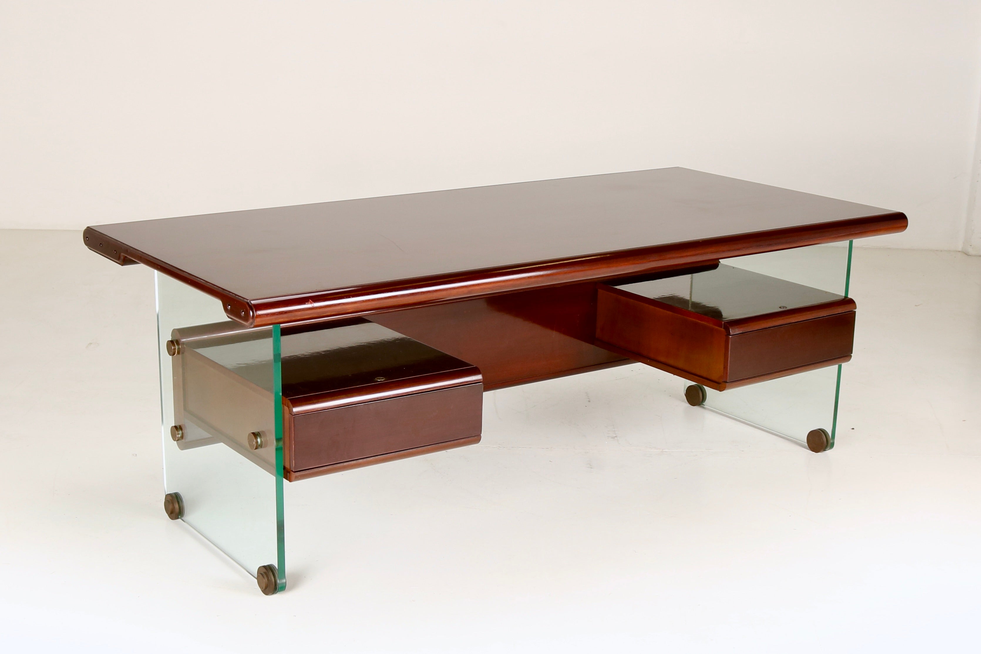  This wood and glass desk attribuited to Fabio Lenci is a gorgeous piece of Italian design. Meticulously crafted, the combination of wood and glass and its essential lines creates an harmonious and elegant workspace. The desk presidential dimensions