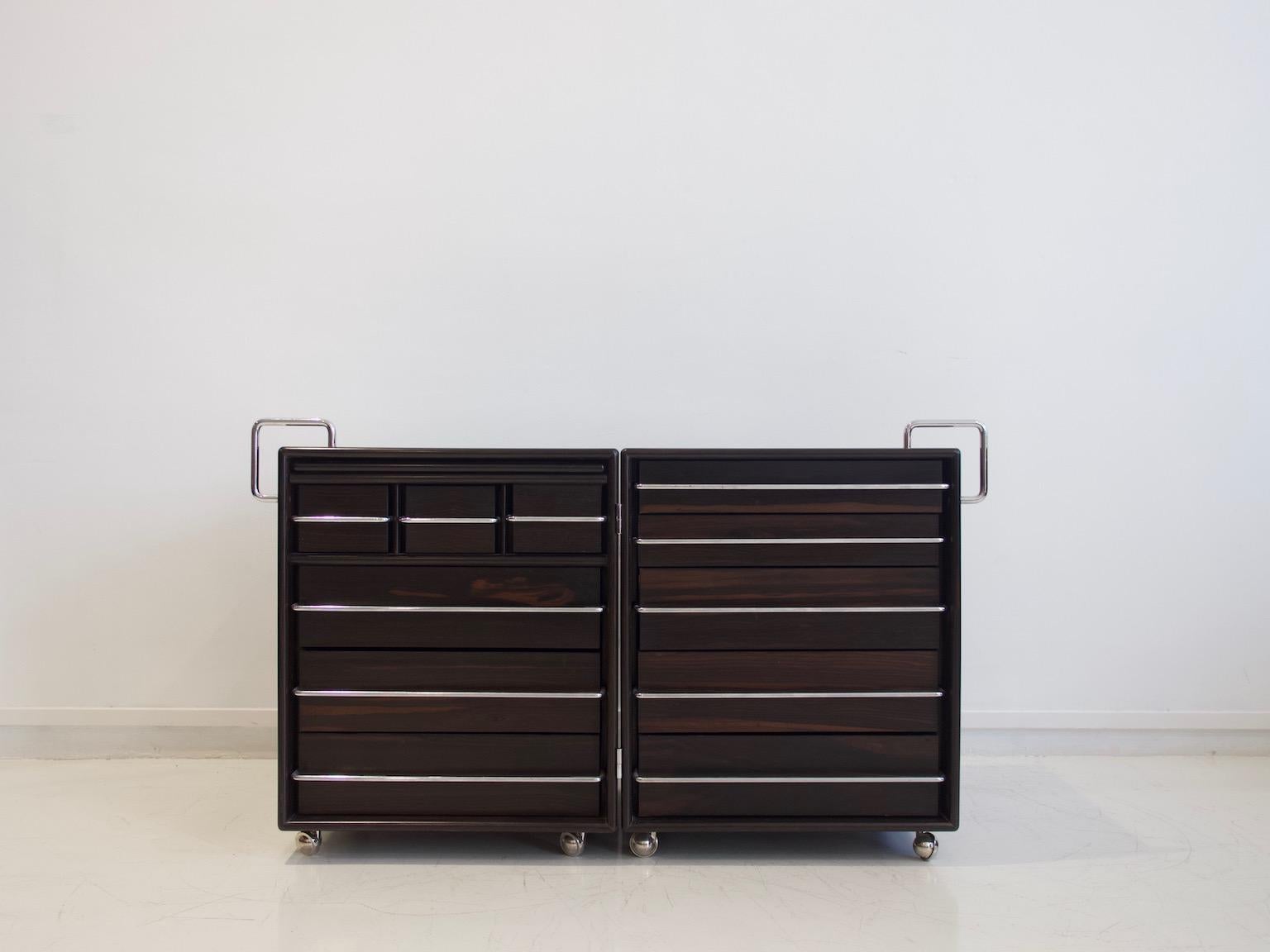 Chest of drawers/dressing table made of two adjustable compartments hinged together, which can be opened and closed as demonstrated on the photos. Made of solid wood and veneered plywood in some parts, handles in chromed steel. Produced by Bernini