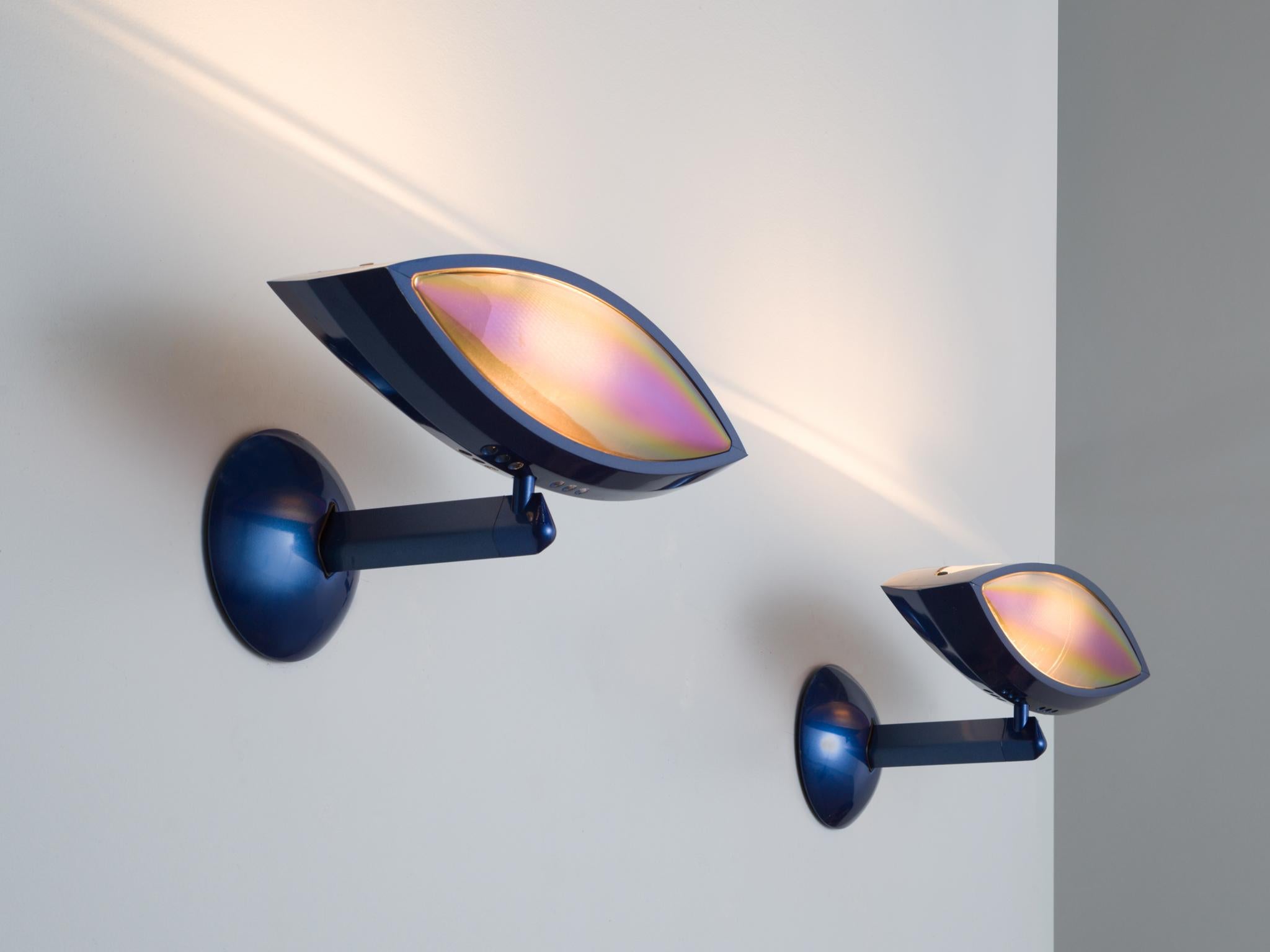 Franco Lombardo for Flos, 'Aeto' blue wall lights, metal, Italy, 1980s.

Well-designed pair of wall lights that features an adjustable eye-form light and has a round black metal base and a blue stem. This lamp is archetypical for post-war Italian