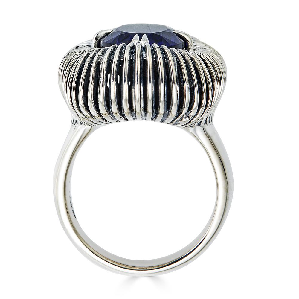 This Fabri Emergence Blue Sapphire and Sterling Silver Ring is part of an exclusive John Brevard line for 1stDibs. This ring helps the wearer activate the love and connection that resides within us all. Featuring a large created blue sapphire set in