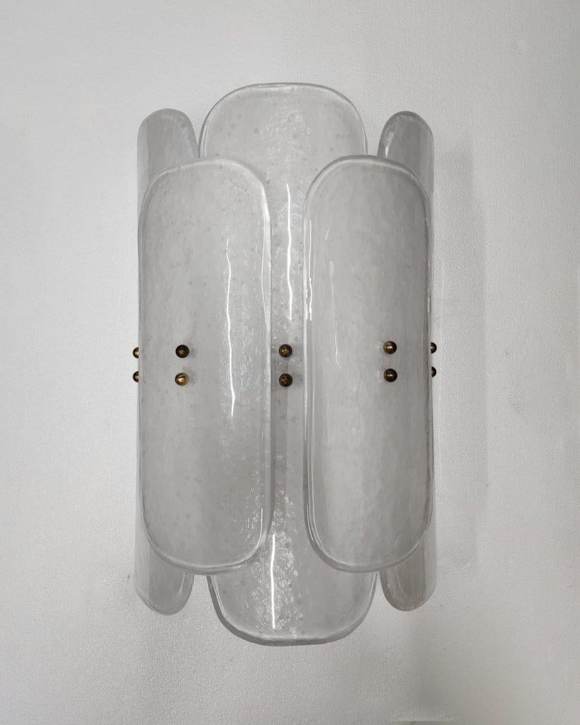 Italian Murano Wall Sconces made by eModerno, meticulously created in Italy to meet the highest standards of quality.
These versatile sconces offer customisable configurations featuring two differing sizes of rectangular glass securely affixed to a