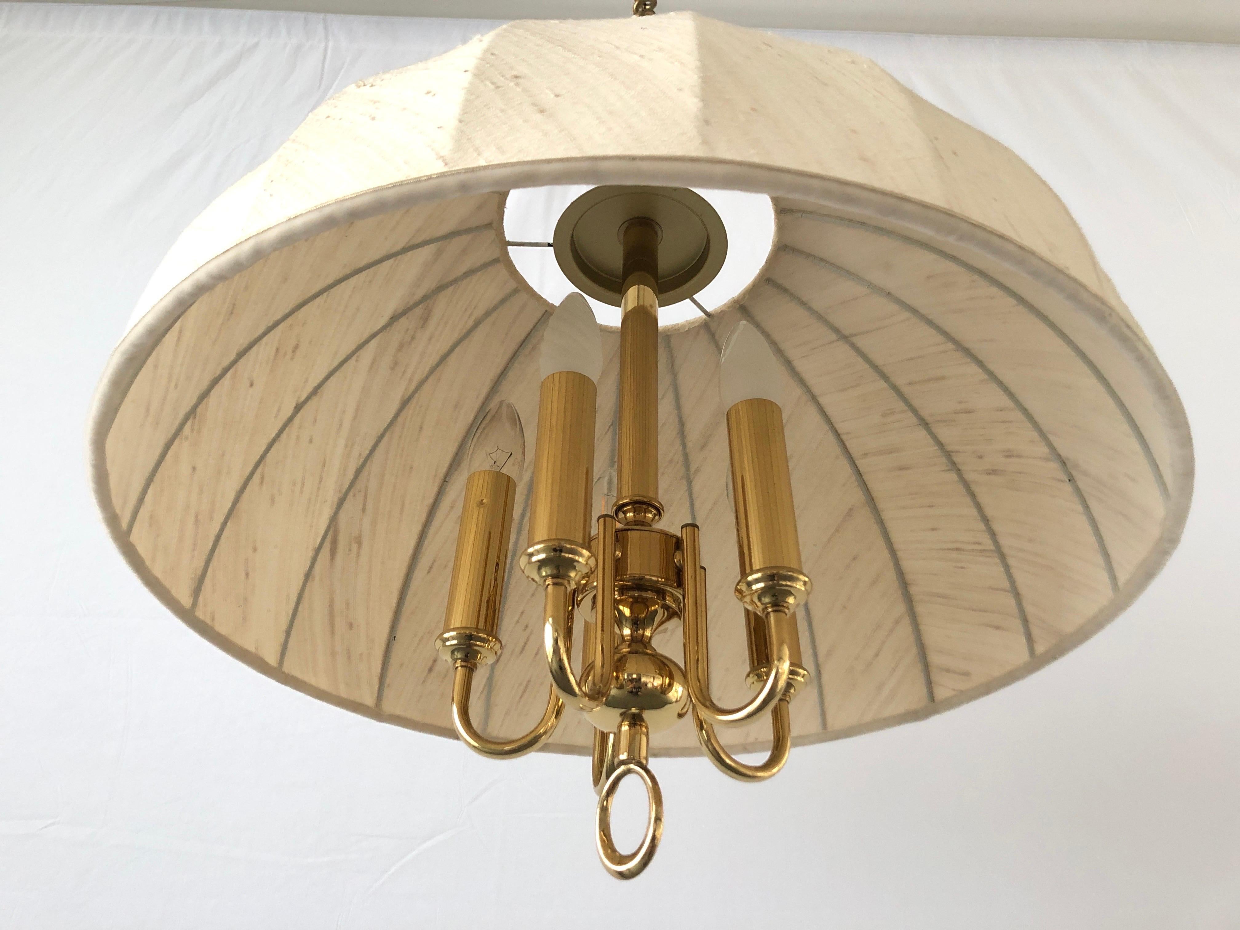 Beige Fabric and Brass 5 socket Adjustable Shade Mid-century Modern XL Pendant Lamp by WKR, 1970s, Germany

Adjustable large lampshade.

Brass body & fabric shade
Manufactured in Germany

This lamp works with 5 x E14 light bulbs.

Measures: 
Height