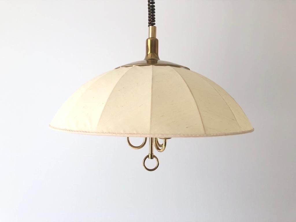 Fabric and Brass Adjustable Shade Pendant Lamp by Schröder & Co, 1970s, Germany

Adjustable large lampshade.

Brass body & fabric shade
Manufactured in Germany

This lamp works with 3 x E27 light bulbs.

Measures: 
Height up to : 162 cm
Shade