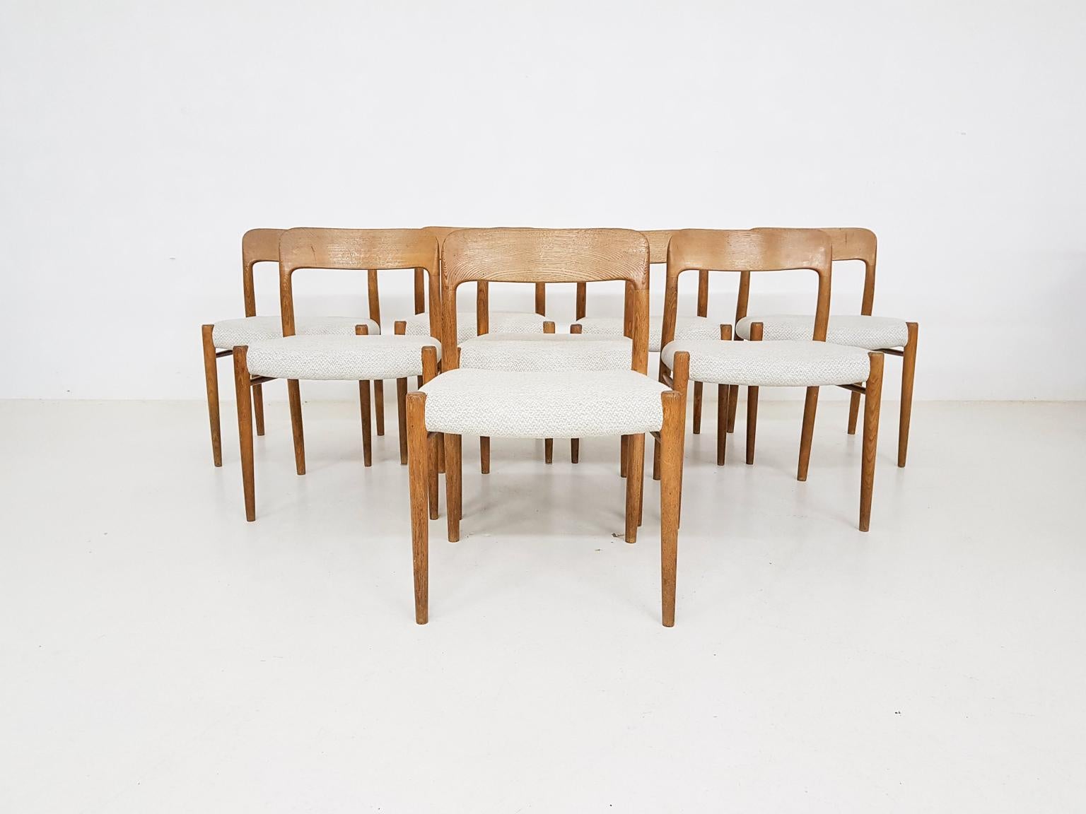 A set of eight vintage Niels Otto Møller for Møller models No75 dining chairs in oak and new fabric, made in Denmark in the 1960’s.

This set of 8 is one of Niels Otto Møllers most  famous models. There were a couple of variations in the choises
