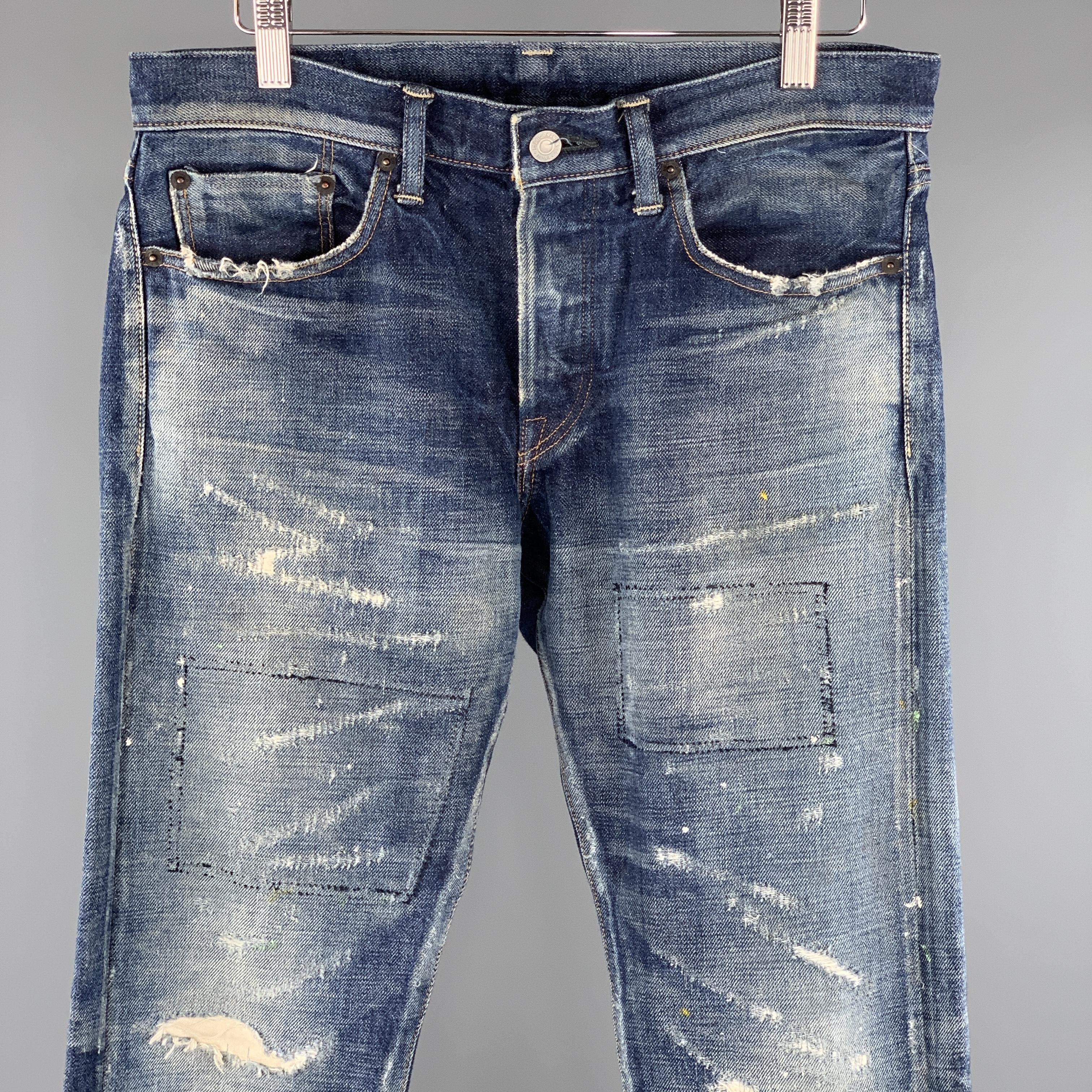 FABRIC BRAND & Co. jeans comes in a indigo washed selvedge denim featuring a slim fit style, distressed throughout, contrast stitching, paint splatter details, and a button fly closure. Made in Japan.
 
Excellent Pre-Owned Condition.
Marked: 30/34

