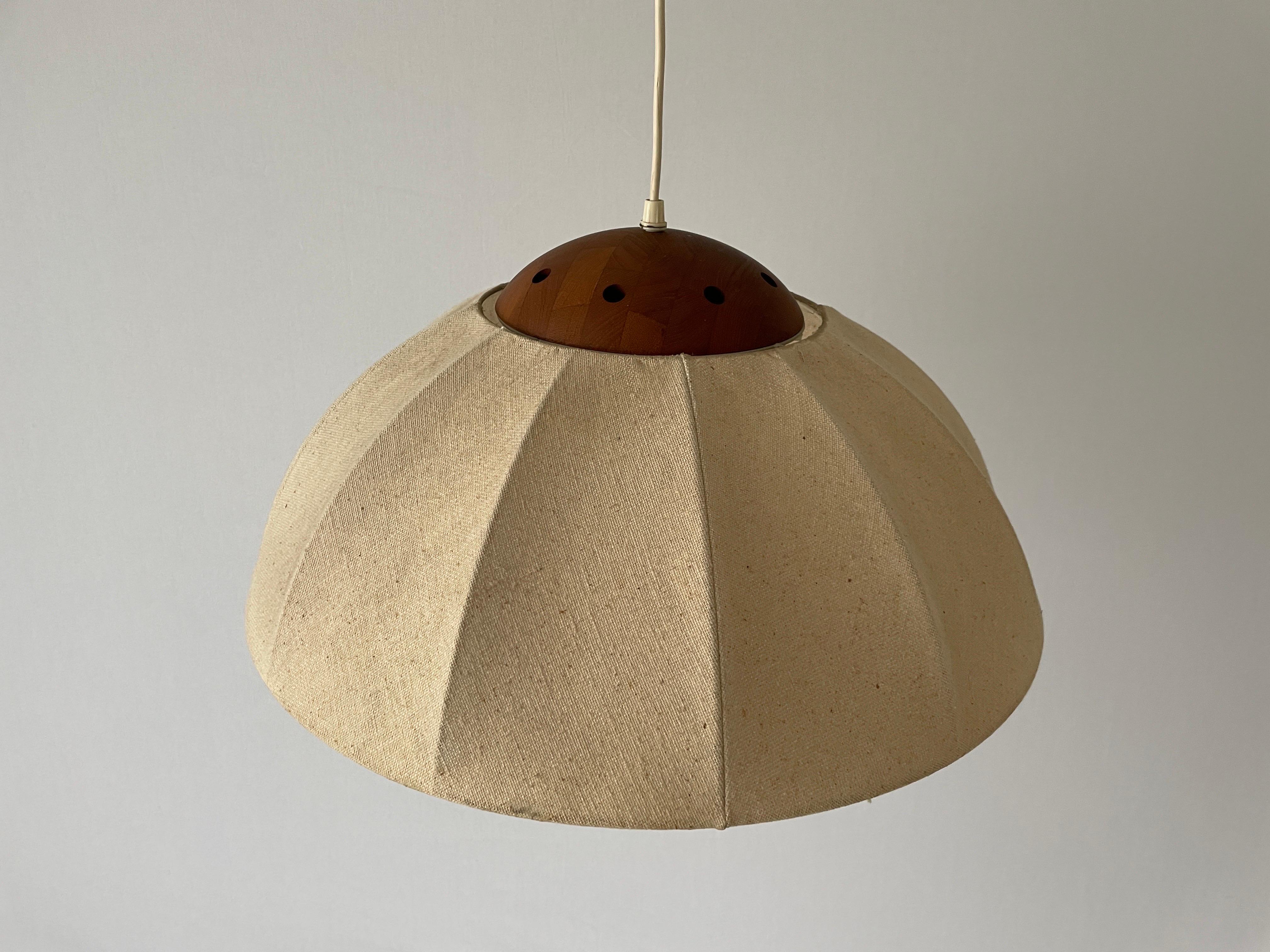 Fabric Pendant Lamp with Teak Detail by Domus, 1960s, Germany

Minimalist and rare design. 

Lampshade is in good condition and clean. 
This lamp works with E27 light bulb. 
Max 100W Wired and suitable to use with 220V and 110V for all countries.