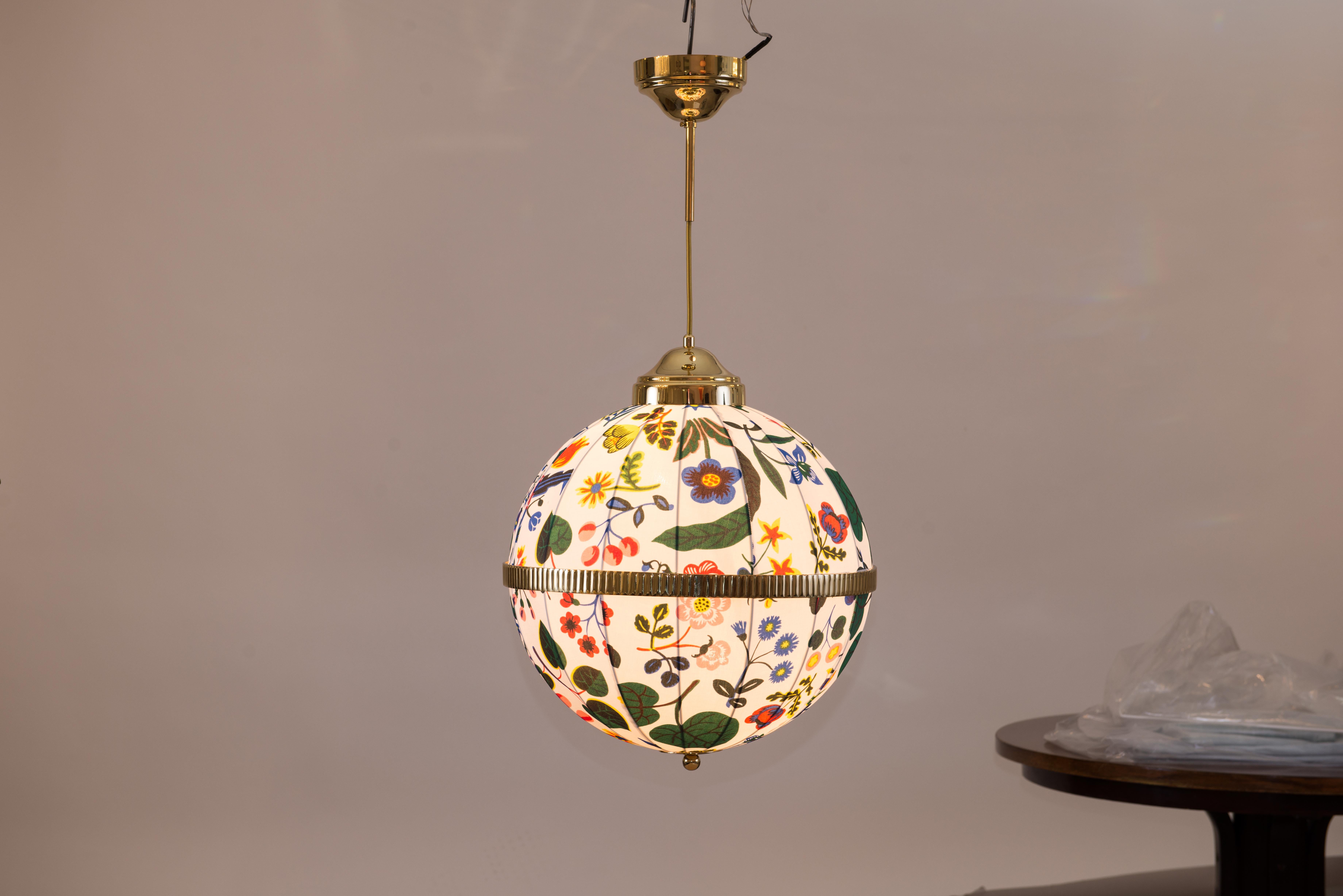 Handsewn fabric shade, dessin by Josef Frank for Svenskt Tenn, hanging on a fabric-covered wire, brass-parts in the requested finish.
Total drop custom made
2 x Edison screw sockets E12/E14 for incandescent or LED
Most components according to the UL