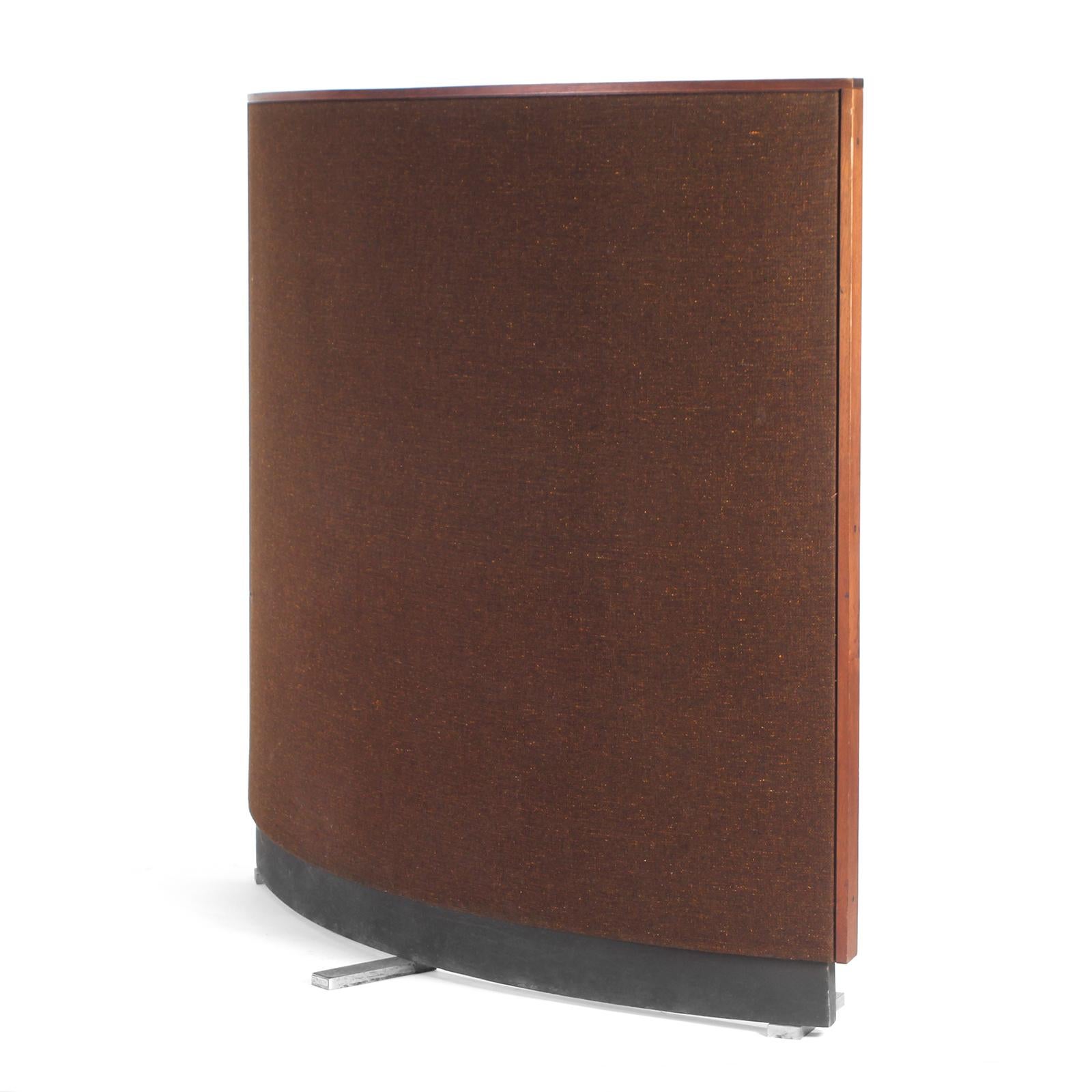 A curved room divider with a solid wood frame upholstered in brown fabric.