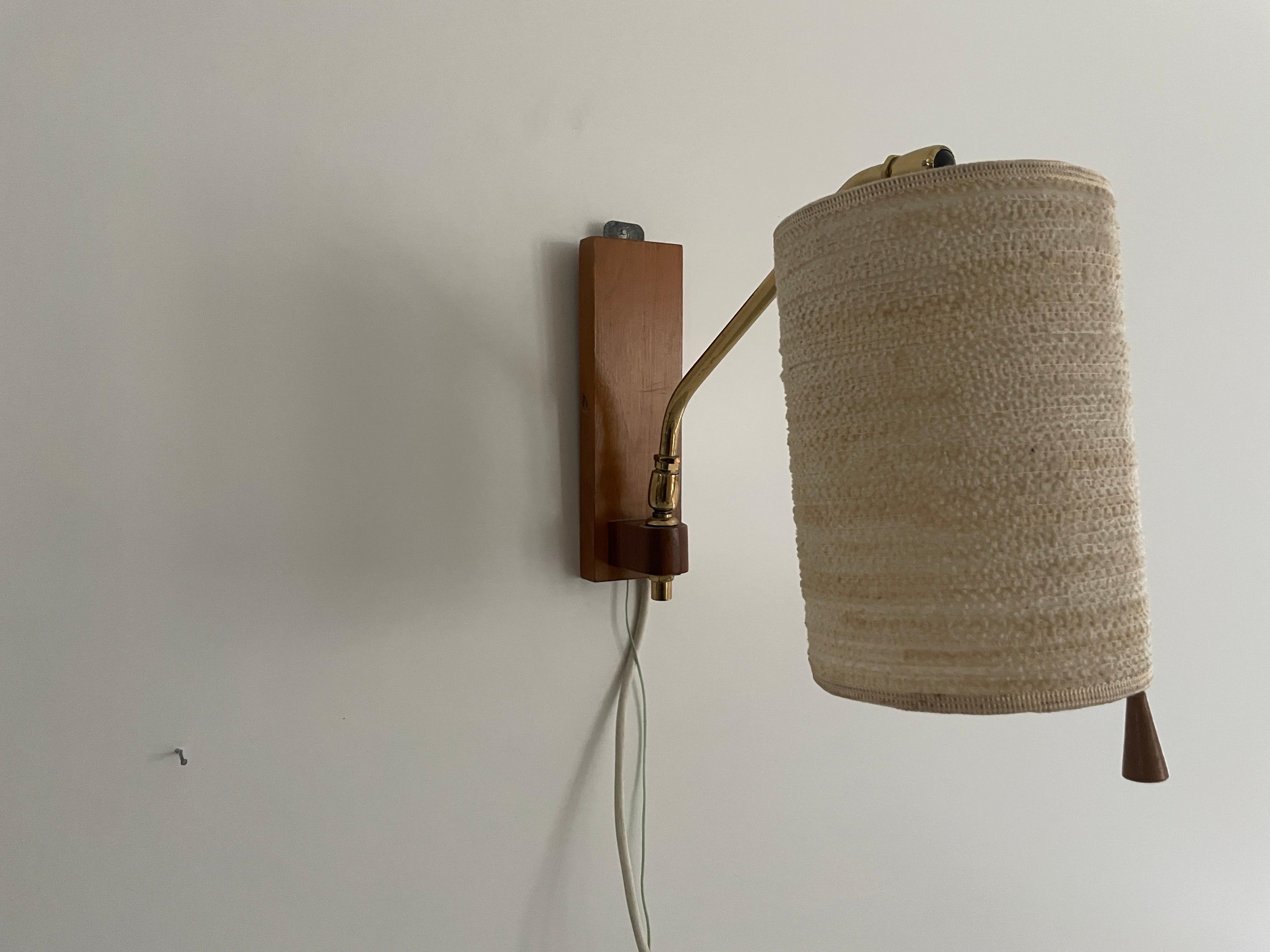 Fabric Shade and Wood Wall Lamp with Brass Neck, 1960s, Germany

Lampshade is in very good vintage condition.
No crack, no missed piece.

This lamp works with E27 light bulb. Max 100W
Wired and suitable to use with 220V and 110V for all