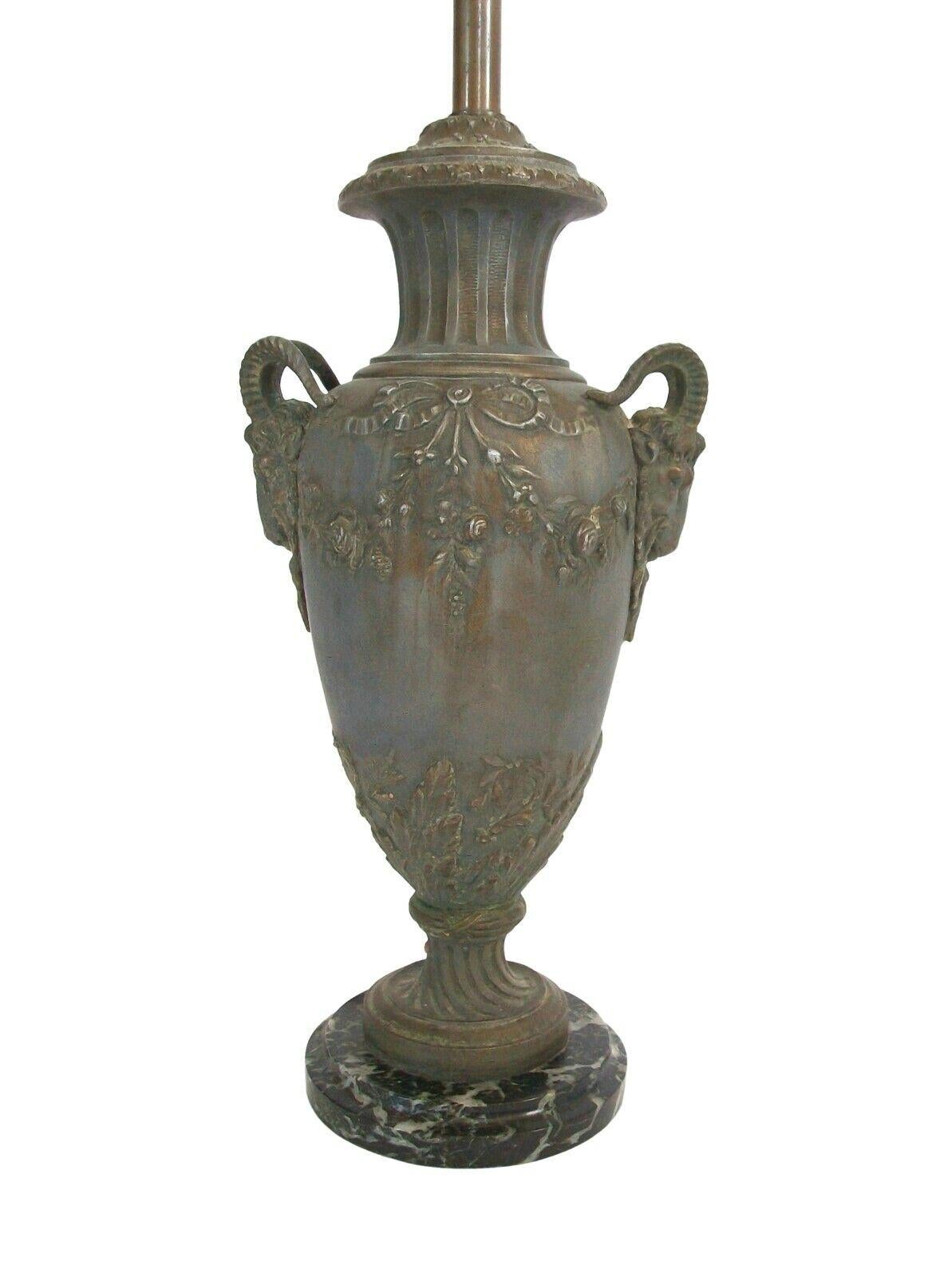Fabrication Française (Consortium of French Foundries - Active 1892-1915) - Antique Louis XVI style Cassolette lamp - medium size - verdigris finish - featuring Ram's head handles to each side - embossed floral swags and bows to the front and back -