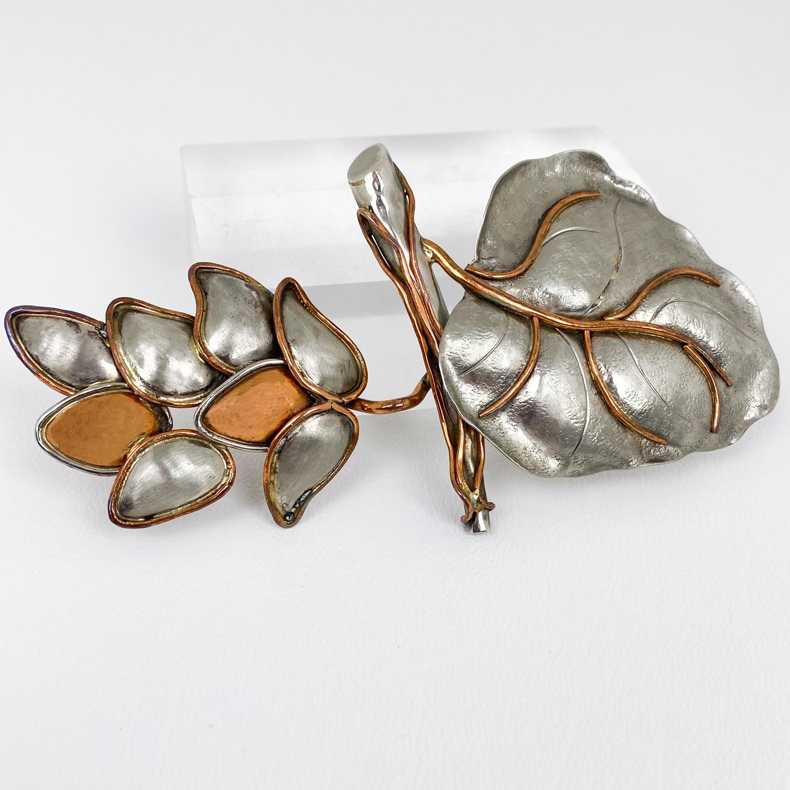 Fabrice, Paris designed this gorgeous floral pin brooch. The rare piece features a massive polished pewter-copper leaf, and flower shape with dimensional hand-raised and carved detailing. The pin has a security closing clasp and is marked at the