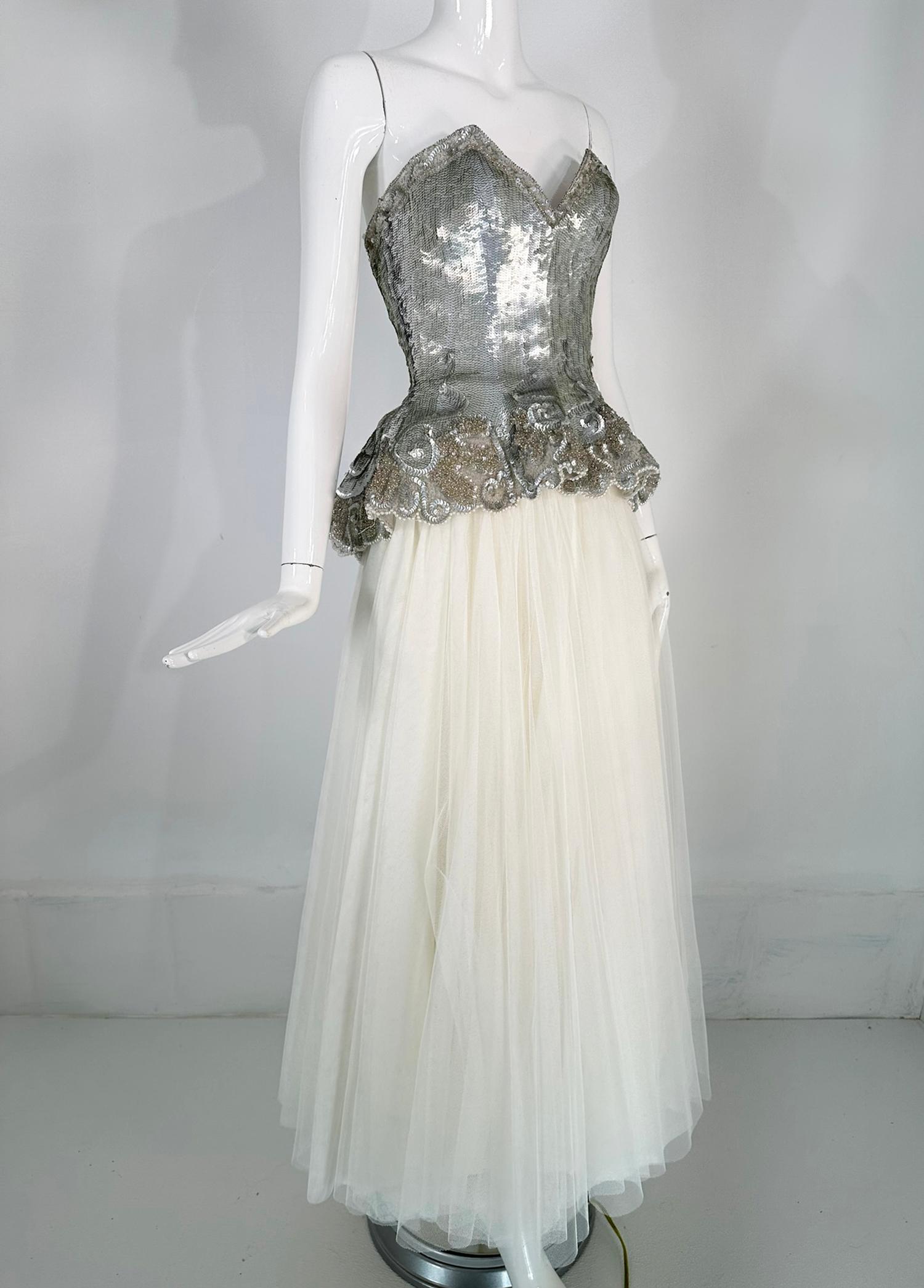 Fabrice Couture gold & silver sequin peplum hem bustier with white layered tulle skirt from the 1980s. The bustier is completely covered in silver & gold sequins and glass beads, it glitters & glows under the lights & is perfect paired with the