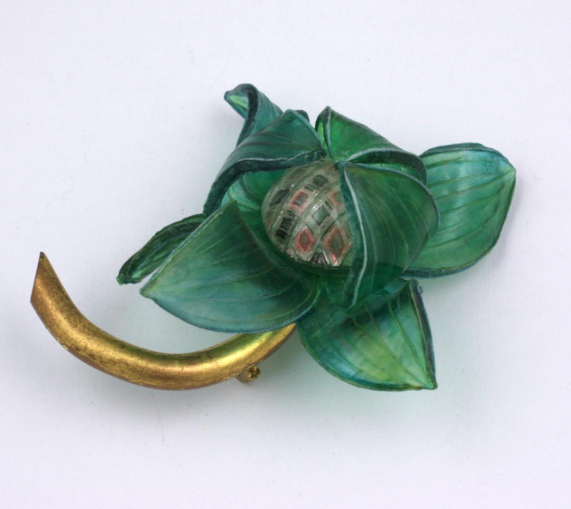 Striking Fabrice Green Resin Flower Brooch from Paris. Hand molded resin is etched and curled to form petals, scored center and gold leaf stem. 1990's France. 
4