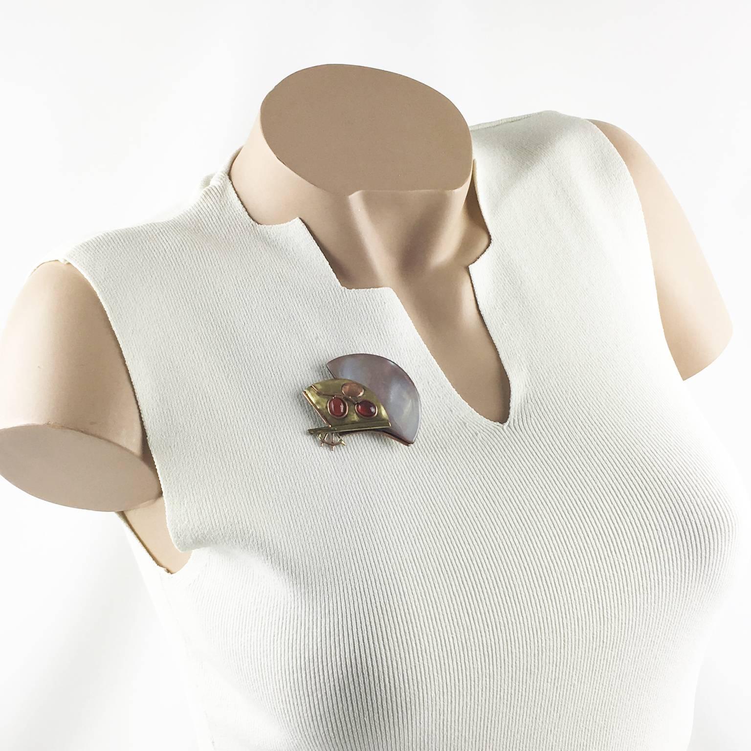 Elegant 1980s Fabrice Paris signed Pin Brooch. Dimensional geometric fan piece with Art Deco inspired feeling. Gilded brass base, topped with real mother of pearl and carnelian glass cabochons and compliment with copper metal accent. That mix and