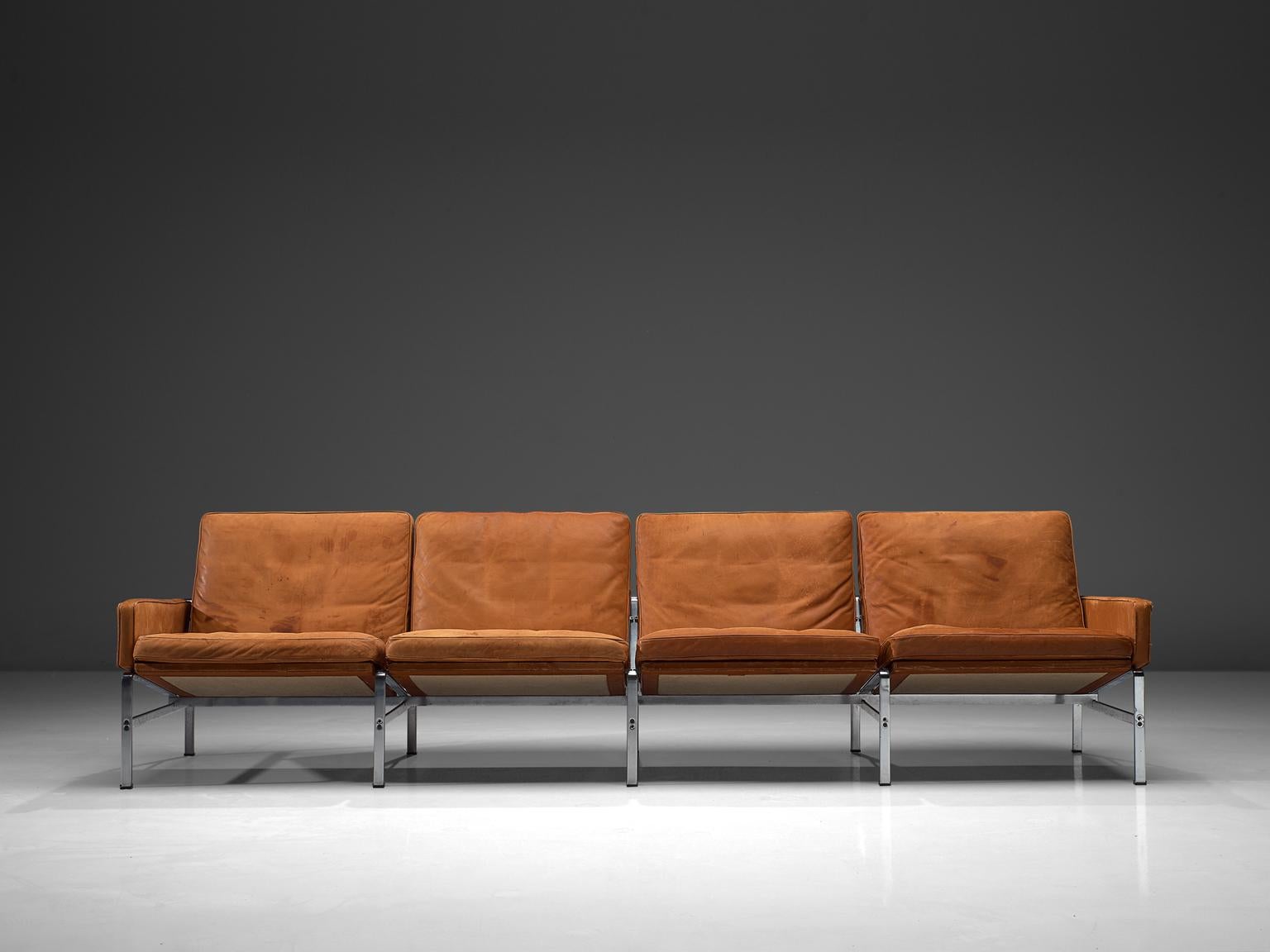 Preben Fabricius & Jørgen Kastholm for Kill International, four-seat sofa, leather and steel, Denmark, circa 1960.

Large sofa in patinated cognac leather by Fabricius and Kastholm. The base of this sofa gives a characteristic and open character.
