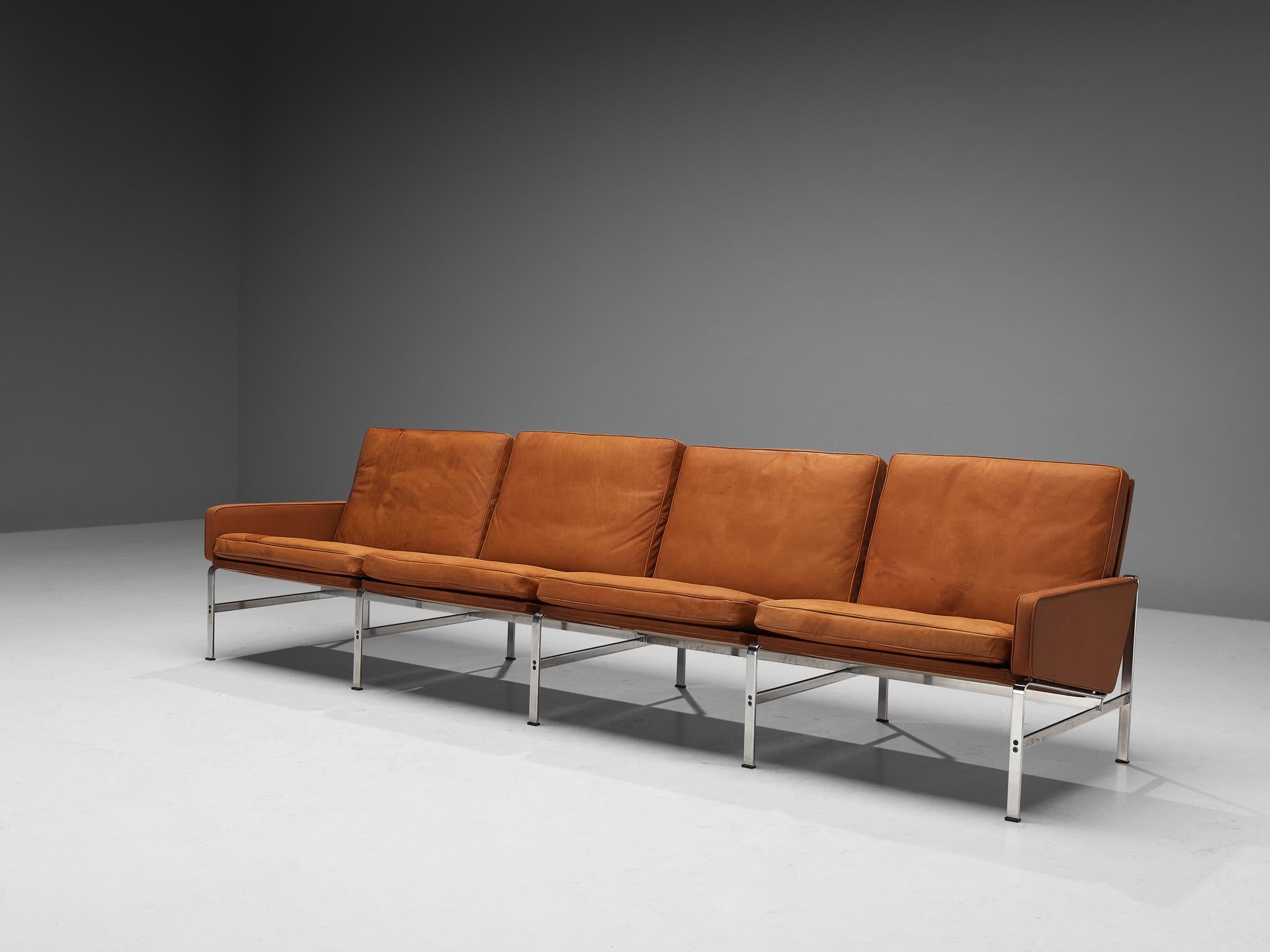Jørgen Kastholm & Preben Fabricius for Kill International, four-seater sofa, patinated leather, steel, Denmark, 1960s.

This sofa embodies a solid construction that is established by clear, sharp lines and vivid geometrical shapes. The way the steel