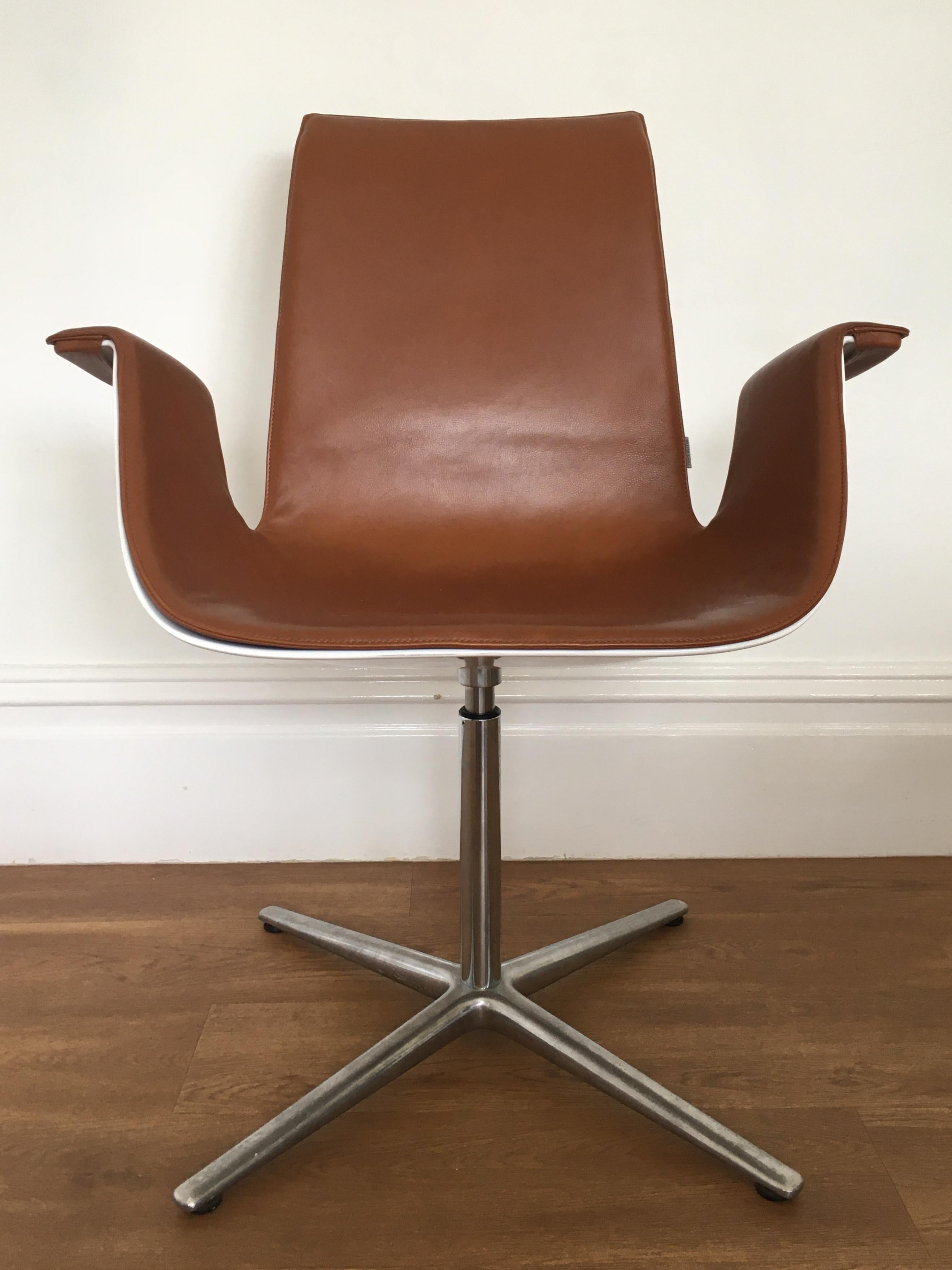 Originally designed in 1967 by Fabricius and Kastholm the FK bucket chair (also known as the bird chair) is one of the iconic, instantly recognisable, designs from the mid 20th century.

The chair features light tan leather upholstery with a white