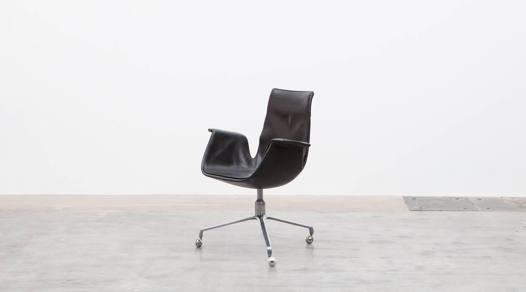 Black leather, chromium-plated, swivel chair by Fabricius and Kastholm, Germany, 1960.

Beautiful black leather swivel armchairs on chromium-plated metal base in great condition. Designed by Preben Fabricius and Jørgen Kastholm. Manufactured by