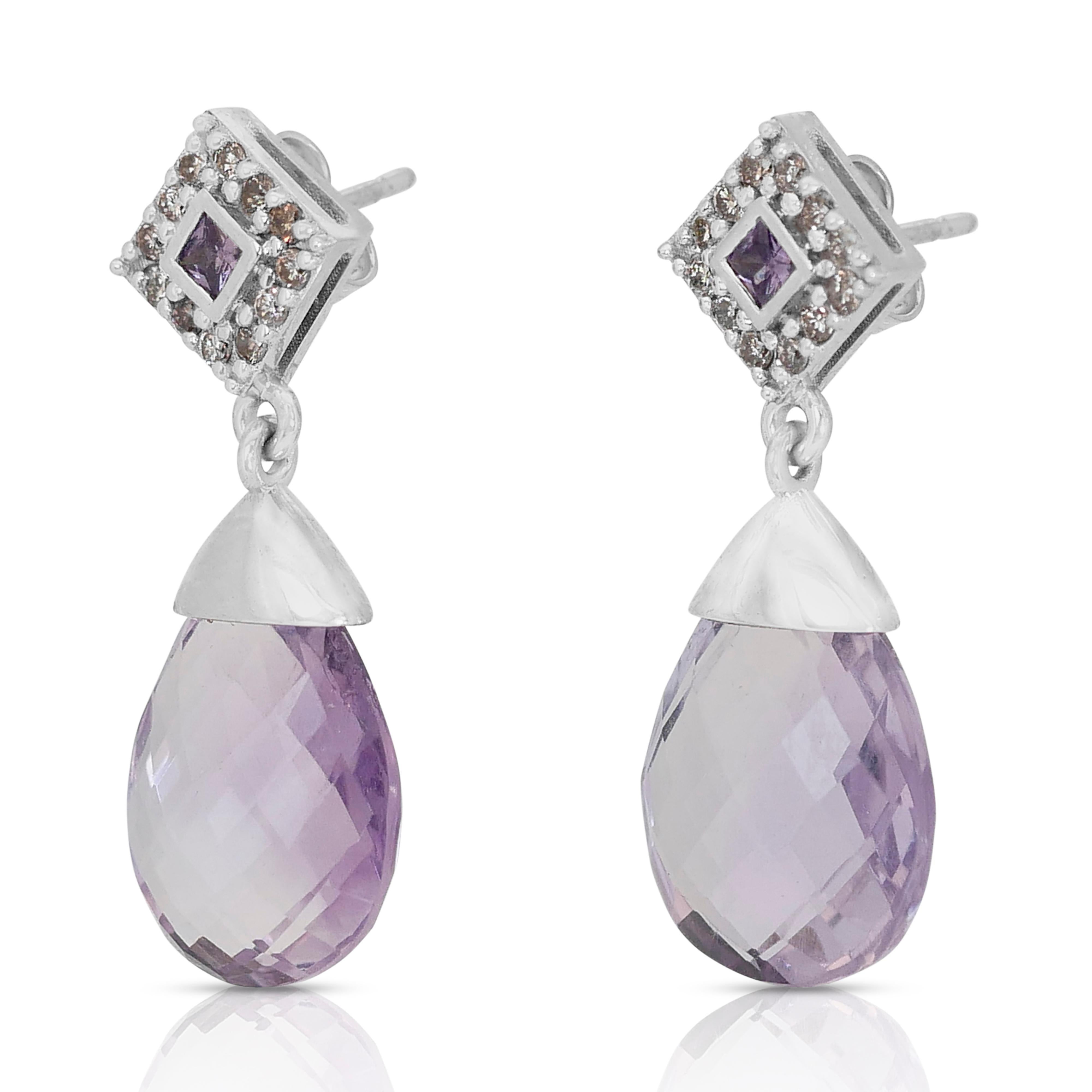 Fabulous 14k White Gold Amethyst and Diamond Dangle Earrings w/17.60 ct - AIG Certified

Make a captivating statement with these luxurious dangle earrings, boasting a stunning combination of vibrant amethysts and sparkling diamonds. The centerpiece