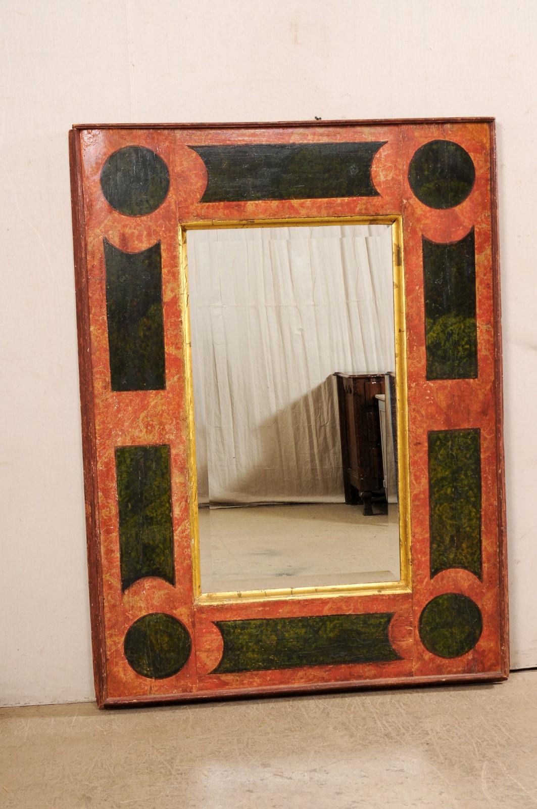 An Italian large-sized wood mirror, with its original hand-painted and gilt finish, from the 18th century. This antique mirror from Italy is a large sized piece at approximately 4.5 feet wide and 6.5 feet in height. This rectangular-shaped mirror