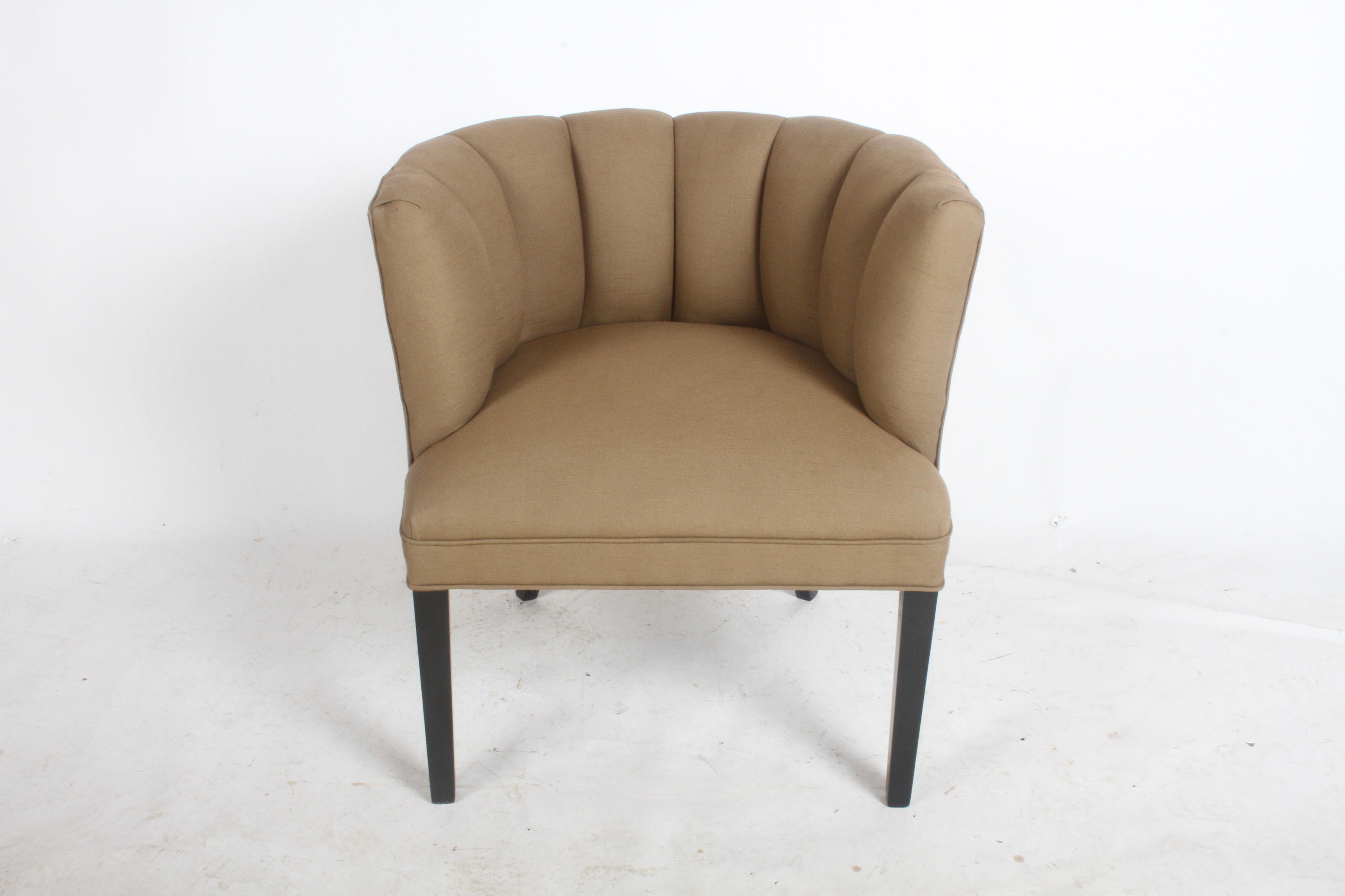 1940s Billy Haines style channel back occasional tub chair, reupholstered in a mocha beige linen fabric with refinished dark mahogany legs. 

